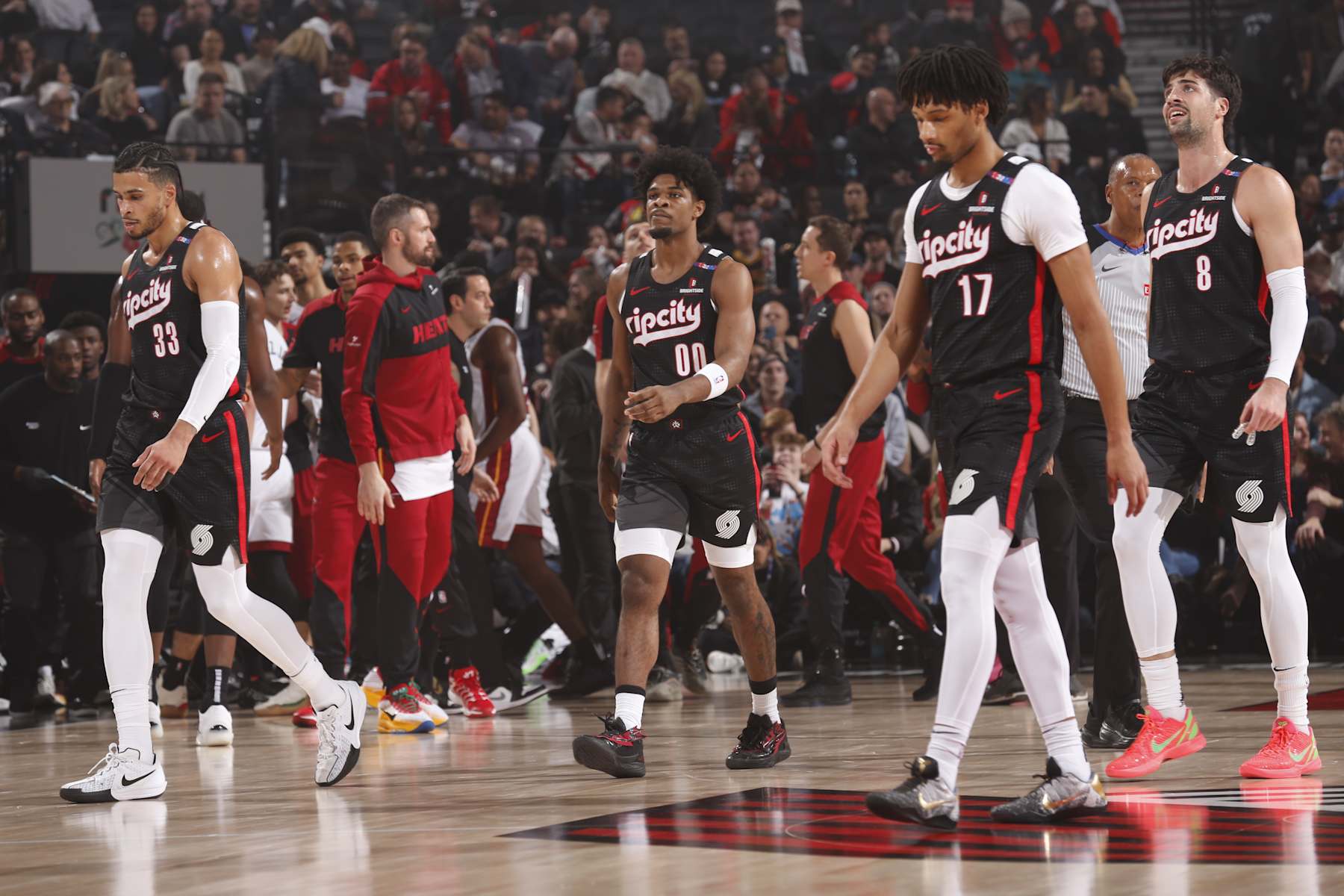 PORTLAND, OR - JANUARY 11:  Toumani Camara #33, Scoot Henderson #00, Shaedon Sharpe #17 and Deni Avdija #8 of the Portland Trail Blazers during the game against the Miami Heat on January 11, 2025 at the Moda Center Arena in Portland, Oregon. NOTE TO USER: User expressly acknowledges and agrees that, by downloading and or using this photograph, user is consenting to the terms and conditions of the Getty Images License Agreement. Mandatory Copyright Notice: Copyright 2025 NBAE (Photo by Cameron Browne/NBAE via Getty Images)