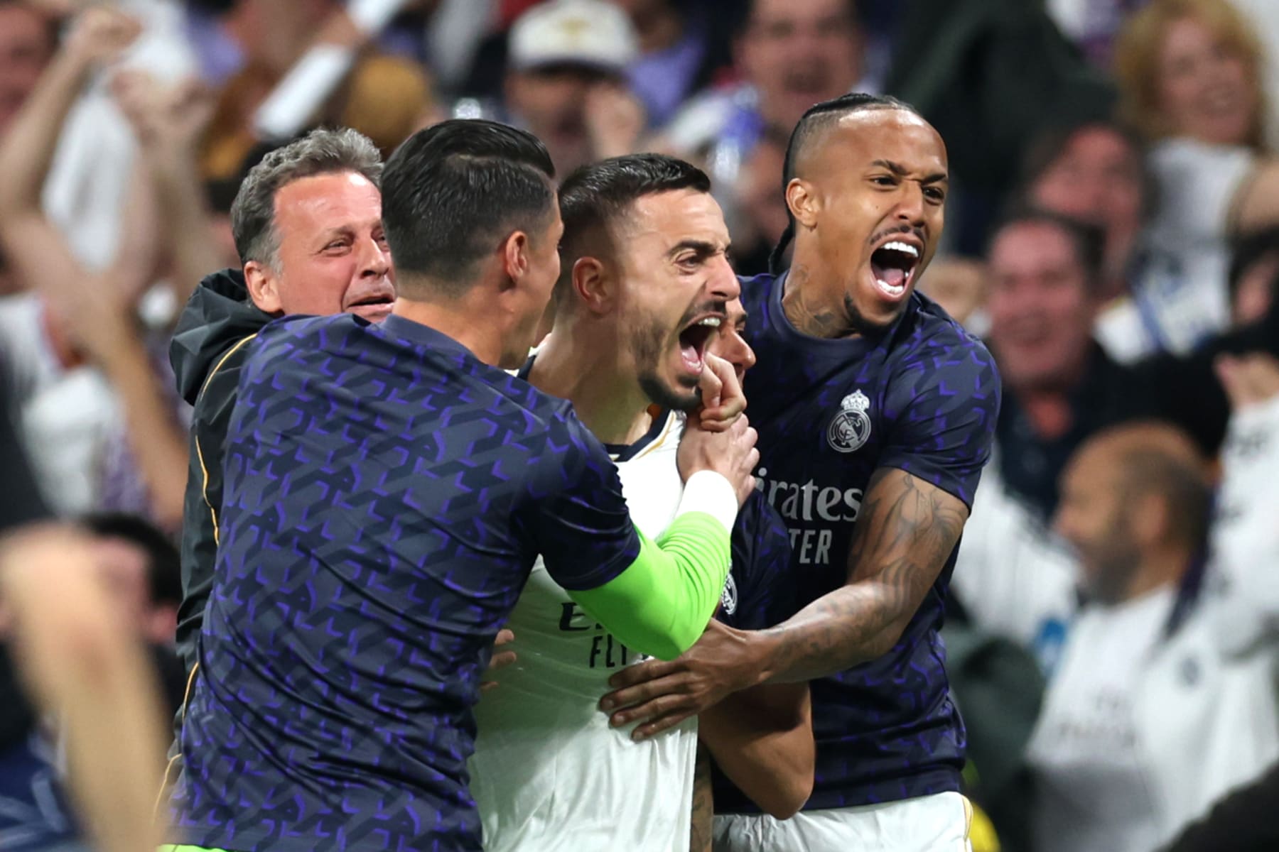 MADRID, SPAIN - MAY 08: Joselu of Real Madrid celebrates scoring his team's first goal with teammates during the UEFA Champions League semi-final second leg match between Real Madrid and FC Bayern München at Estadio Santiago Bernabeu on May 08, 2024 in Madrid, Spain. (Photo by Clive Brunskill/Getty Images)