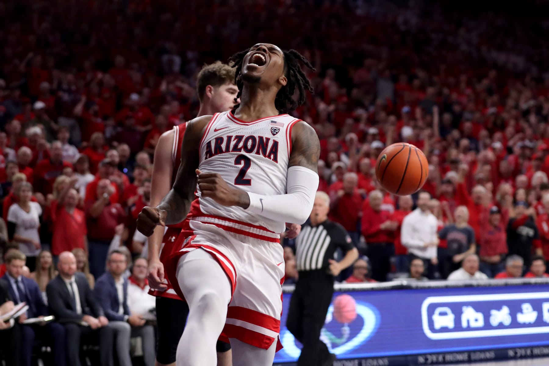 TUCSON, AZ - DECEMBER 09: Arizona Wildcats guard Caleb Love #2 celebrates a dunk during the first half of a men's basketball game between the Wisconsin Badgers and the University of Arizona Wildcats on December 9, 2023 at McKale Center in Tucson, AZ. (Photo by Christopher Hook/Icon Sportswire via Getty Images)