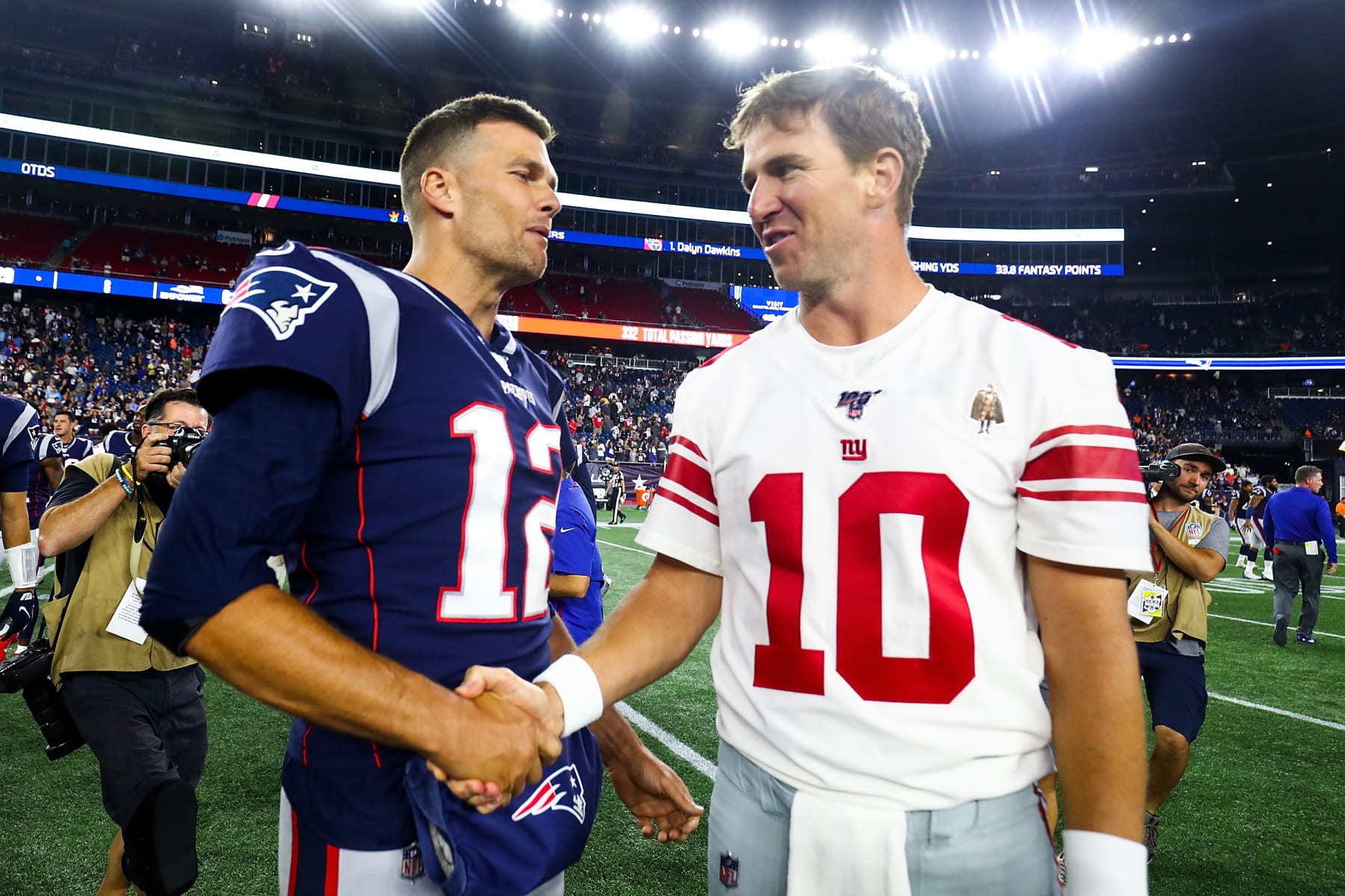 FOXBOROUGH, MA - AUGUST 29:   Tom Brady #12 of the New England Patriots greets Eli Manning #10 of the New York Giants after a preseason game at Gillette Stadium on August 29, 2019 in Foxborough, Massachusetts.  (Photo by Adam Glanzman/Getty Images)