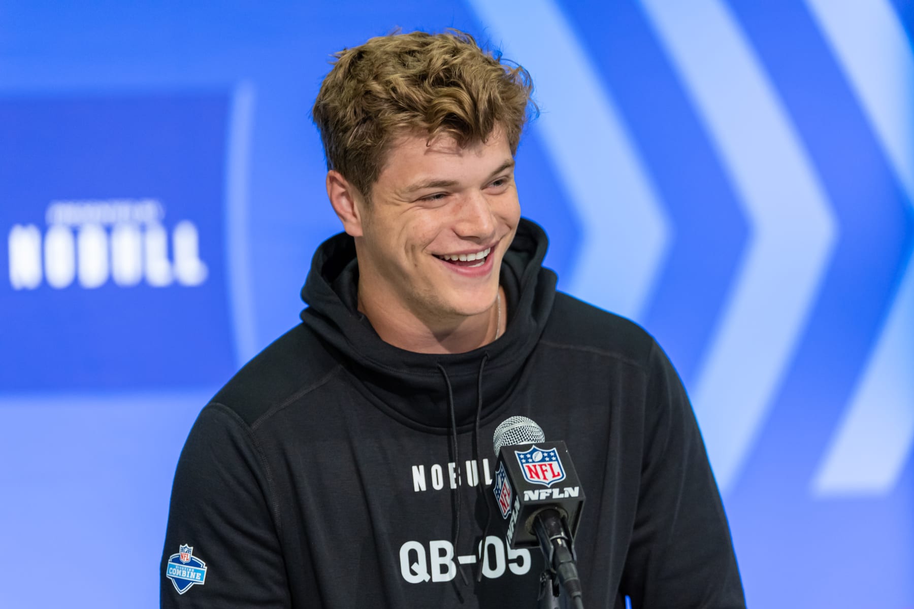INDIANAPOLIS, INDIANA - MARCH 01: JJ McCarthy #QB05 of the Michigan Wolverines speaks to the media during the 2024 NFL Draft Combine at Lucas Oil Stadium on March 01, 2024 in Indianapolis, Indiana. (Photo by Michael Hickey/Getty Images)