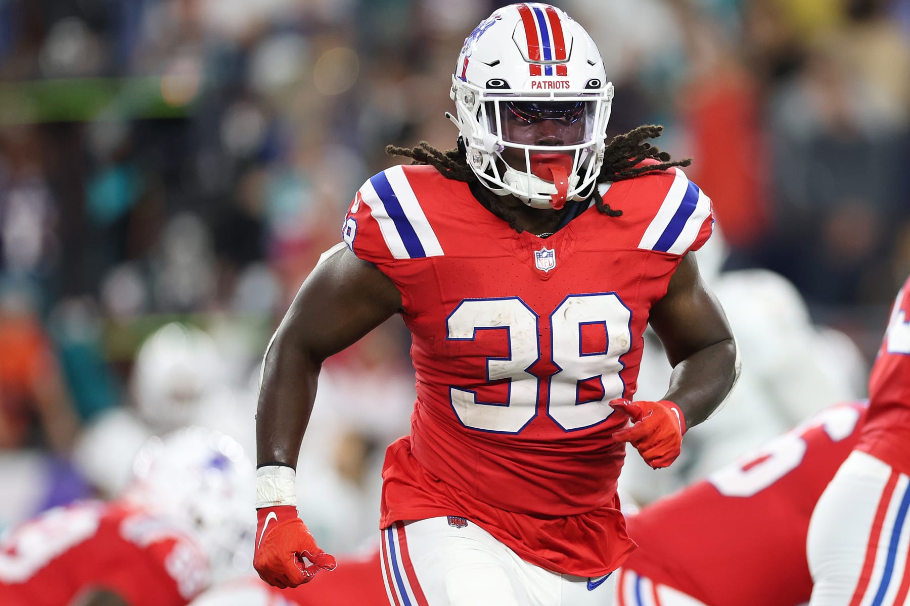 FOXBOROUGH, MASSACHUSETTS - SEPTEMBER 17: Rhamondre Stevenson #38 of the New England Patriots runs against the Miami Dolphins  at Gillette Stadium on September 17, 2023 in Foxborough, Massachusetts. (Photo by Maddie Meyer/Getty Images)