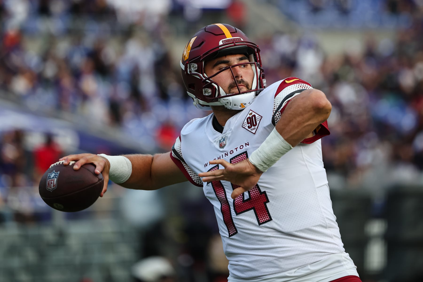 BALTIMORE, MD - AUGUST 27: Sam Howell #14 of the Washington Commanders warms up before the preseason game against the Baltimore Ravens at M&T Bank Stadium on August 27, 2022 in Baltimore, Maryland. (Photo by Scott Taetsch/Getty Images)