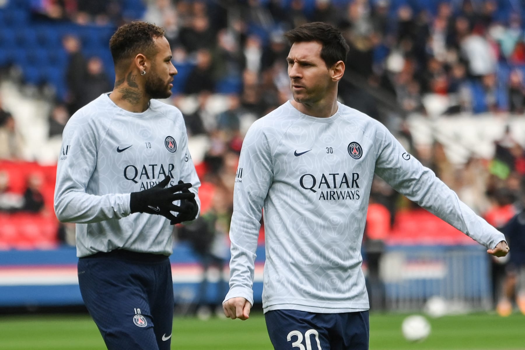Paris Saint-Germain's Argentine forward Lionel Messi (R) and Paris Saint-Germain's Brazilian forward Neymar (L) warm up prior to the French L1 football match between Paris Saint-Germain (PSG) and Lille LOSC at The Parc des Princes Stadium in Paris on February 19, 2023. (Photo by FRANCK FIFE / AFP) (Photo by FRANCK FIFE/AFP via Getty Images)