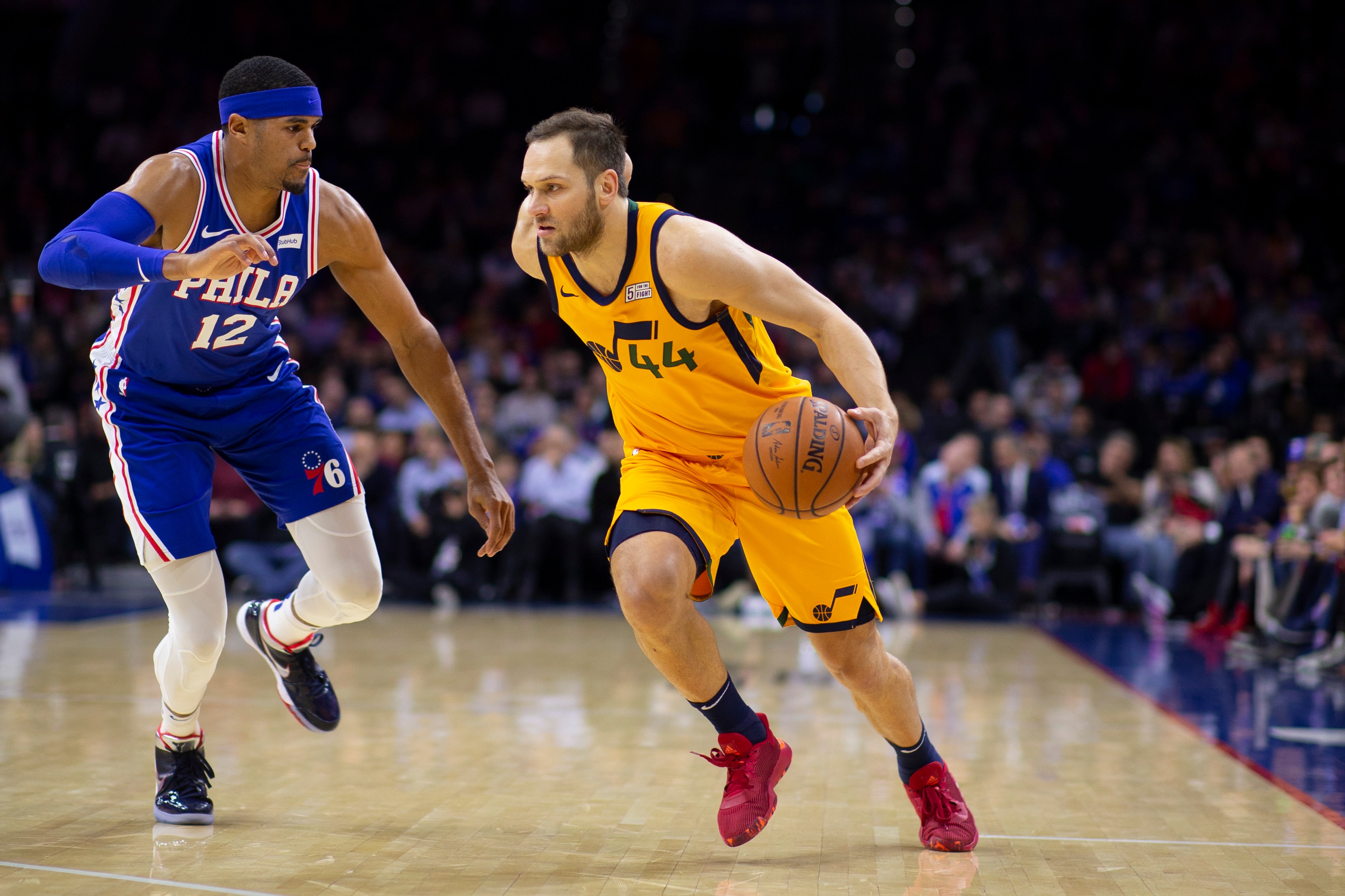 PHILADELPHIA, PA - DECEMBER 02: Bojan Bogdanovic #44 of the Utah Jazz dribbles the ball against Tobias Harris #12 of the Philadelphia 76ers at the Wells Fargo Center on December 2, 2019 in Philadelphia, Pennsylvania. NOTE TO USER: User expressly acknowledges and agrees that, by downloading and/or using this photograph, user is consenting to the terms and conditions of the Getty Images License Agreement. (Photo by Mitchell Leff/Getty Images)