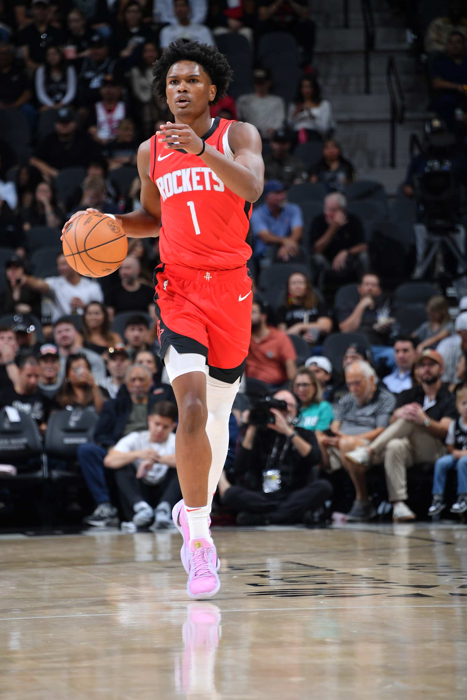 SAN ANTONIO, TX - OCTOBER 28: Amen Thompson #1 of the Houston Rockets dribbles the ball during the game against the San Antonio Spurs  during a regular season game on October 28, 2024 at the Frost Bank Center in San Antonio, Texas. NOTE TO USER: User expressly acknowledges and agrees that, by downloading and or using this photograph, user is consenting to the terms and conditions of the Getty Images License Agreement. Mandatory Copyright Notice: Copyright 2024 NBAE (Photos by Michael Gonzales/NBAE via Getty Images)