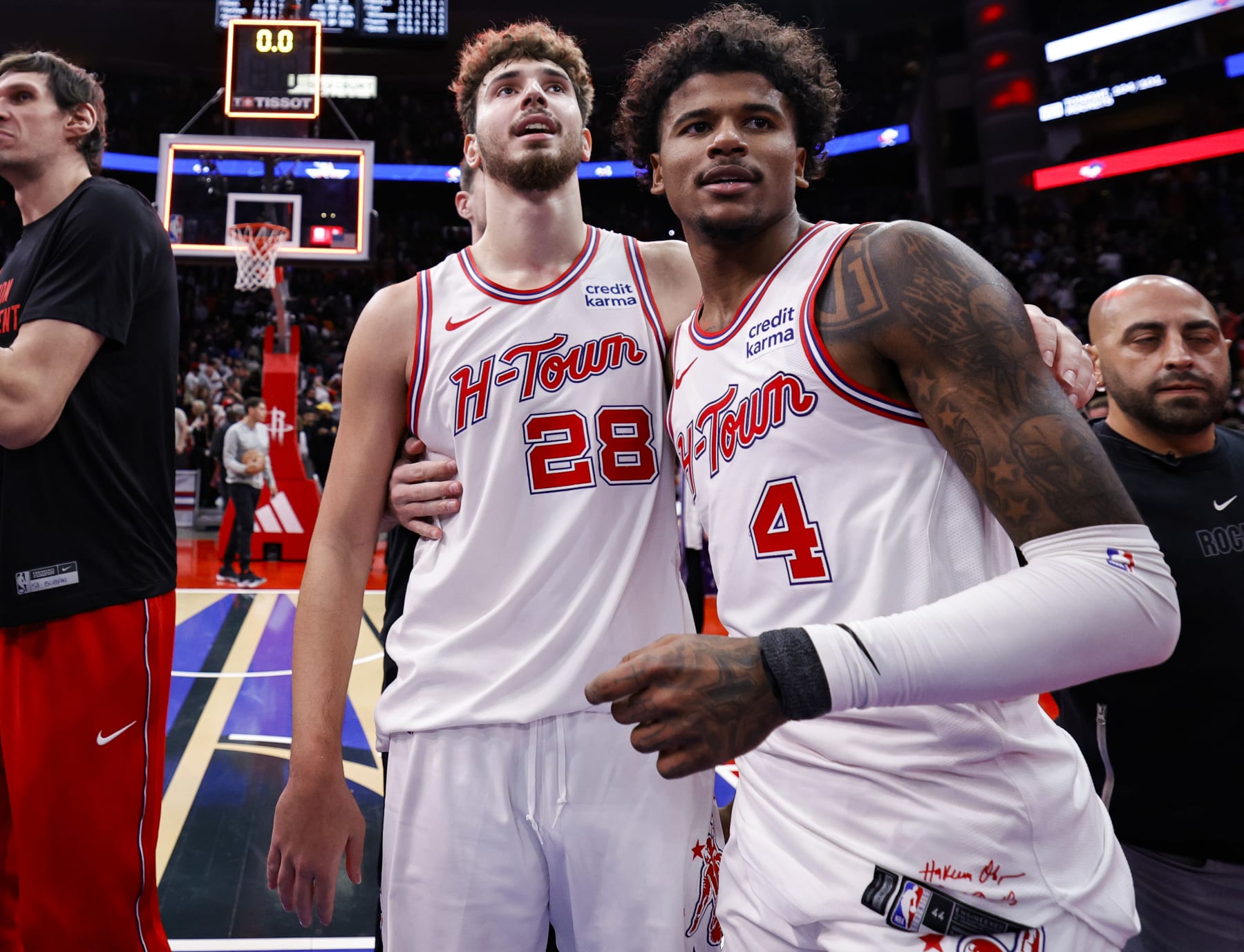HOUSTON, TEXAS - NOVEMBER 10: Alperen Sengun #28 of the Houston Rockets hugs Jalen Green #4 after defeating the New Orleans Pelicans 104-101 at Toyota Center on November 10, 2023 in Houston, Texas. NOTE TO USER: User expressly acknowledges and agrees that, by downloading and or using this photograph, User is consenting to the terms and conditions of the Getty Images License Agreement.  (Photo by Carmen Mandato/Getty Images)