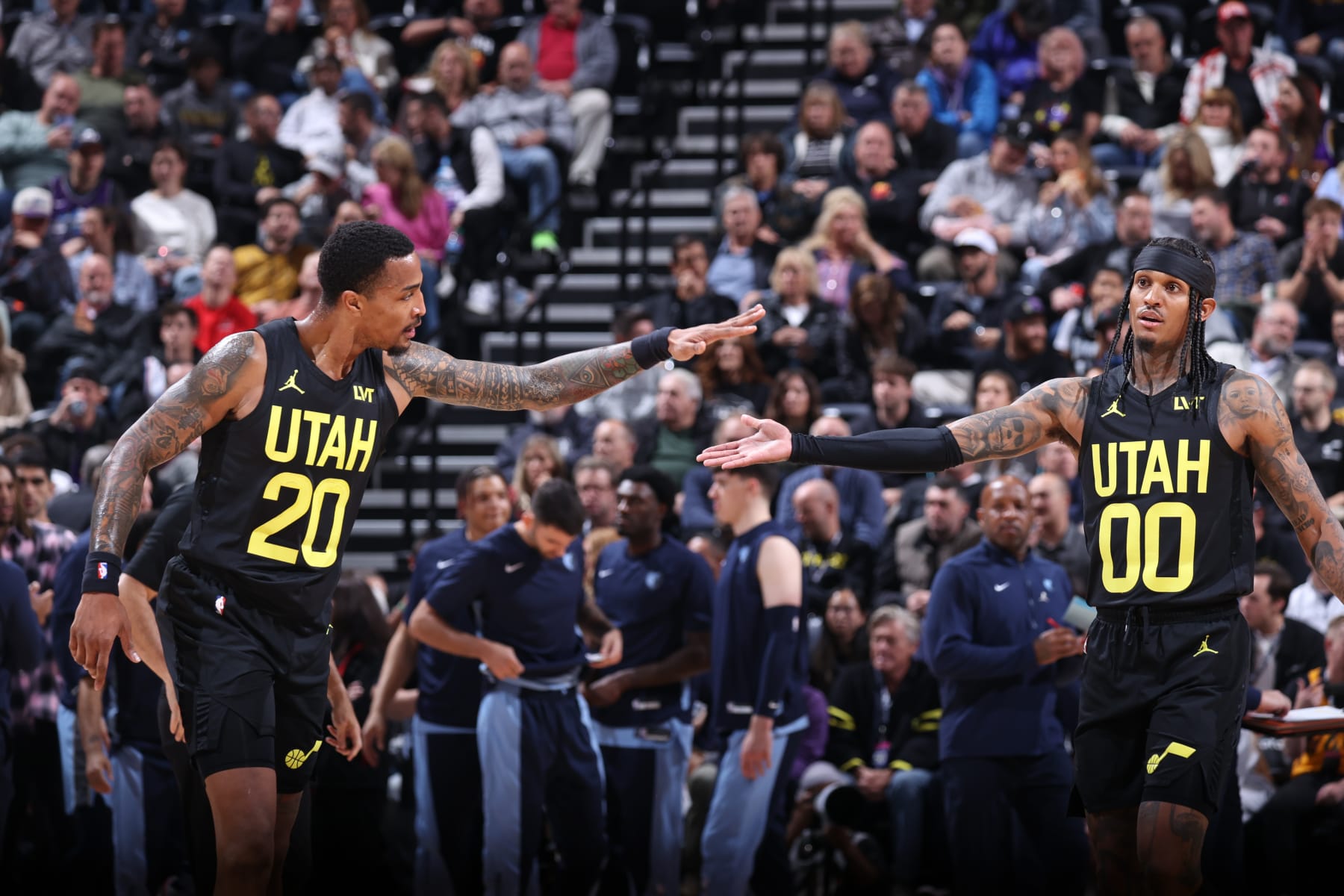 SALT LAKE CITY, UT - NOVEMBER 1: John Collins #20 of the Utah Jazz and Jordan Clarkson #00 of the Utah Jazz high five during the game against the Memphis Grizzlies on November 1, 2023 at vivint.SmartHome Arena in Salt Lake City, Utah. NOTE TO USER: User expressly acknowledges and agrees that, by downloading and or using this Photograph, User is consenting to the terms and conditions of the Getty Images License Agreement. Mandatory Copyright Notice: Copyright 2023 NBAE (Photo by Melissa Majchrzak/NBAE via Getty Images)