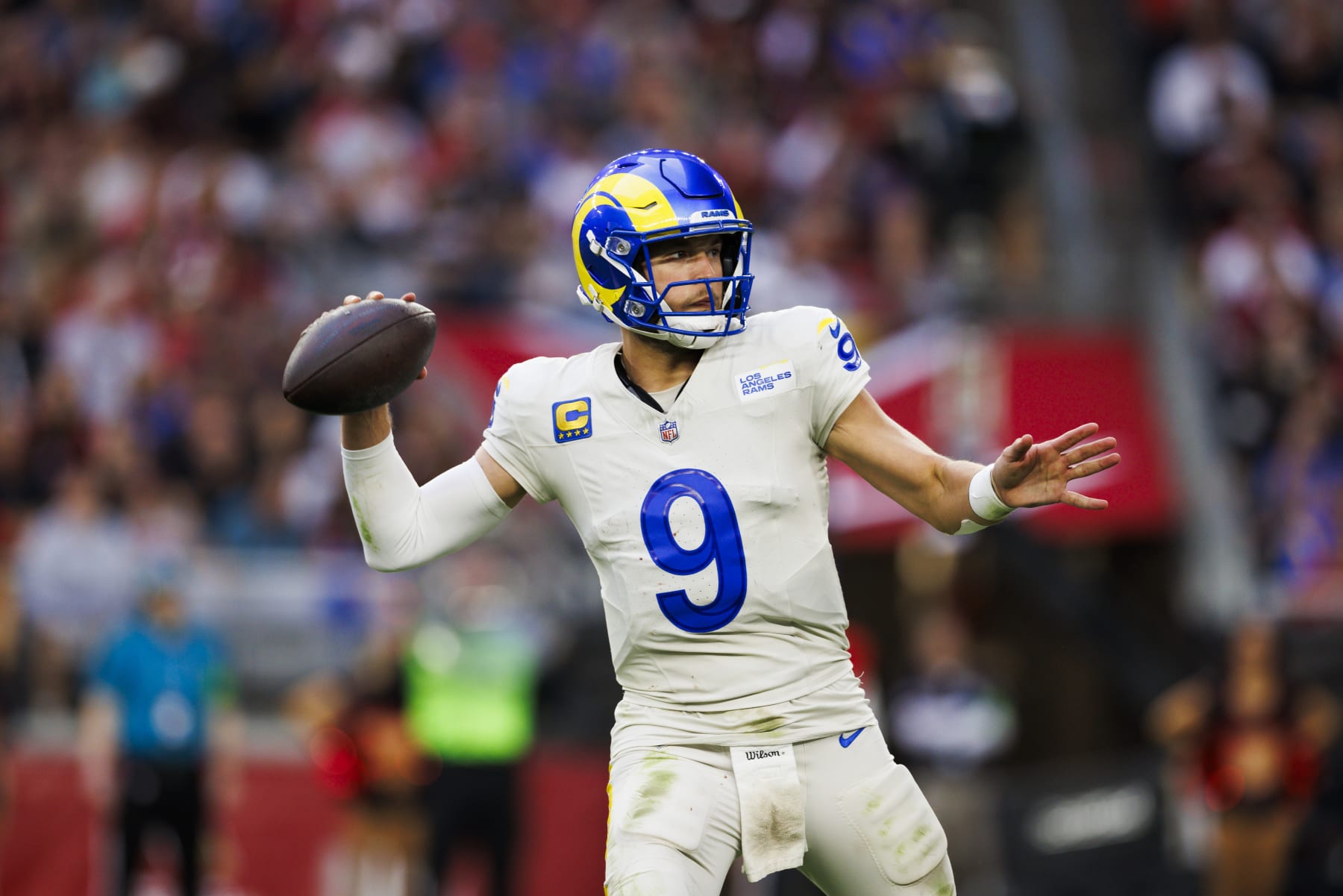 GLENDALE, ARIZONA - NOVEMBER 26: Matthew Stafford #9 of the Los Angeles Rams throws during a game against the Arizona Cardinals at State Farm Stadium on November 26, 2023 in Glendale, Arizona. (Photo by Ric Tapia/Getty Images)