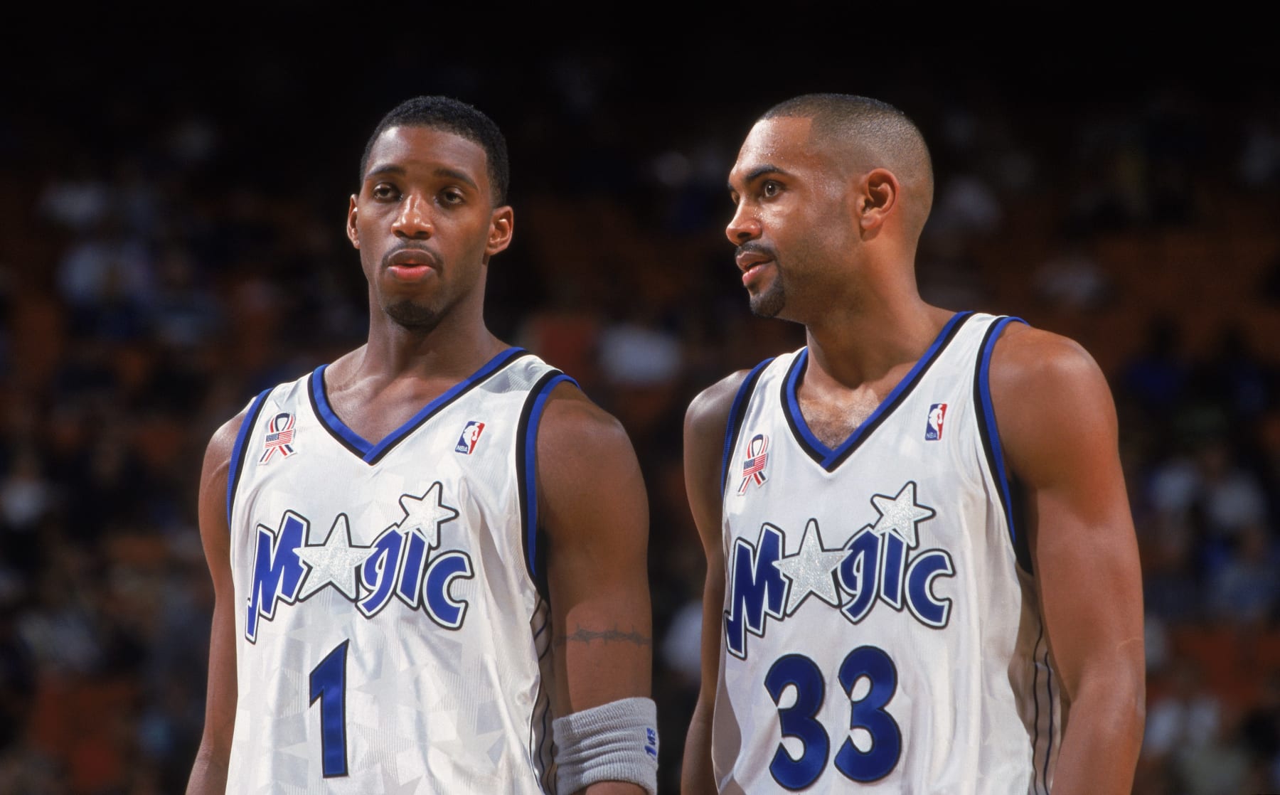 30 Oct 2001:  Forwards Tracy McGrady #1 and Grant Hill #33 of the Orlando Magic confer during the NBA game against the Toronto Raptors at TD Waterhouse Centre in Orlando, Florida.  The Magic defeated the Raptors 114-85.  NOTE TO USER: User expressly acknowledges and agrees that, by downloading and/or using this Photograph, User is consenting to the terms and conditions of the Getty Images License Agreement. Mandatory copyright notice: Copyright 2001 NBAE  Mandatory Credit: Fernando Medina /NBAE/Getty Images