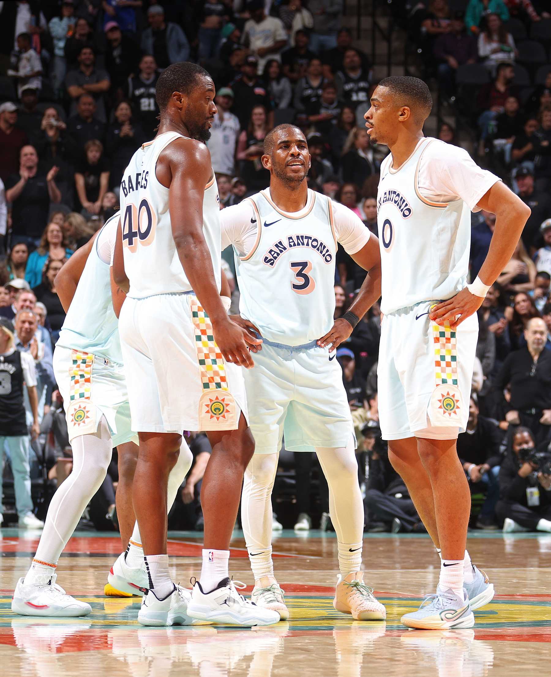 SAN ANTONIO, TX - NOVEMBER 21: Chris Paul #3, Harrison Barnes #40, and Keldon Johnson #0 of the San Antonio Spurs talk during the game against the Utah Jazz on November 21, 2024 at the Frost Bank Center in San Antonio, Texas. NOTE TO USER: User expressly acknowledges and agrees that, by downloading and or using this photograph, user is consenting to the terms and conditions of the Getty Images License Agreement. Mandatory Copyright Notice: Copyright 2024 NBAE (Photos by Nathaniel S. Butler/NBAE via Getty Images)
