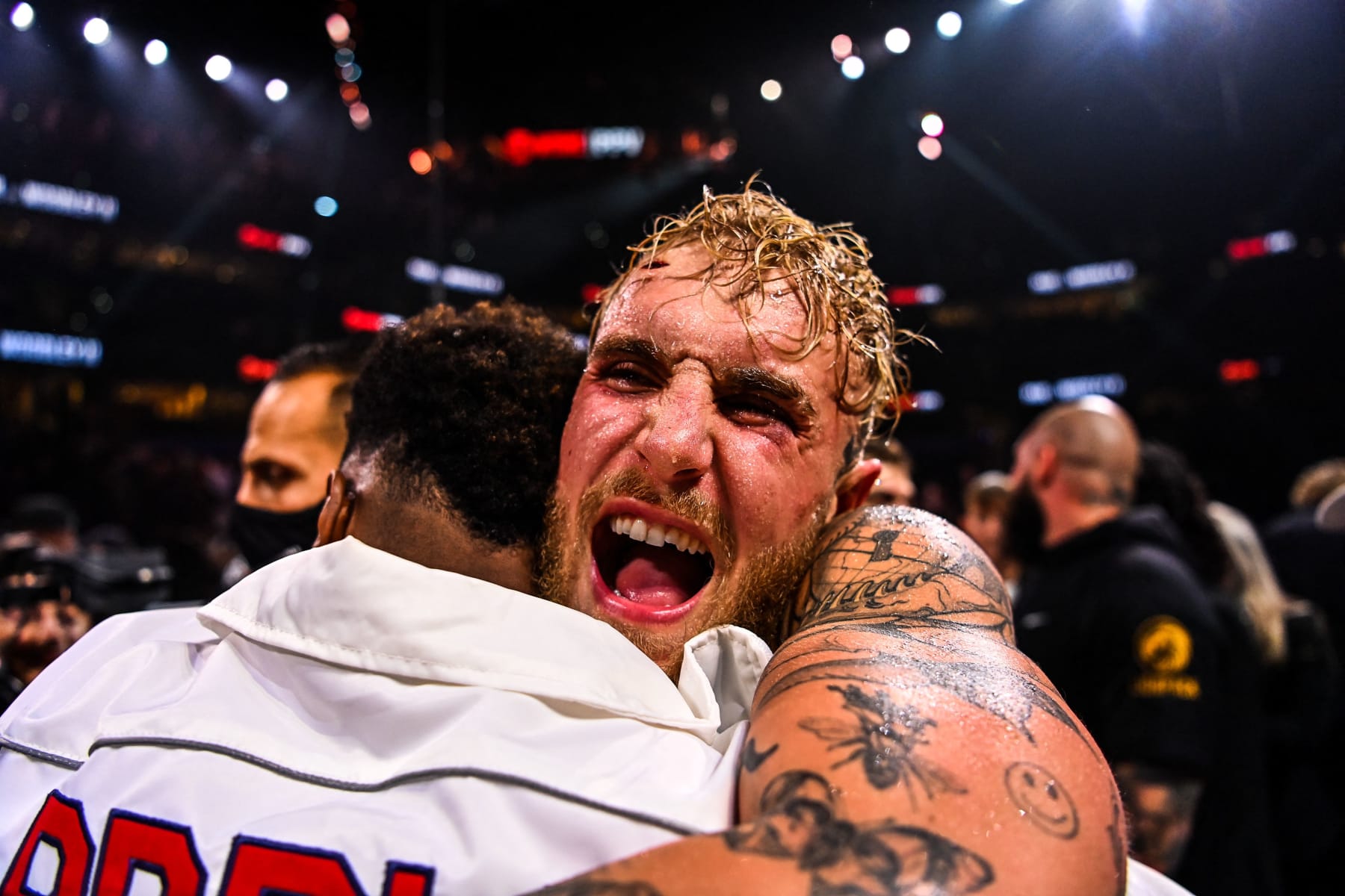 YouTube personality Jake Paul celebrates after knocking out former UFC welterweight champion Tyron Woodley during a fight at the Amalie Arena in Tampa, Florida, on December 18, 2021. (Photo by CHANDAN KHANNA / AFP) (Photo by CHANDAN KHANNA/AFP via Getty Images)