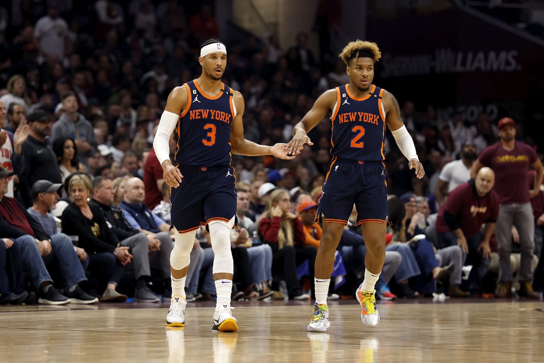 CLEVELAND, OH - APRIL 26:  Josh Hart #3 of the New York Knicks is congratulated by Miles McBride #2 after making a shot during Game Five of the Eastern Conference First Round Playoffs against the Cleveland Cavaliers at Rocket Mortgage Fieldhouse on April 26, 2023 in Cleveland, Ohio. NOTE TO USER: User expressly acknowledges and agrees that, by downloading and or using this photograph, User is consenting to the terms and conditions of the Getty Images License Agreement. (Photo by Kirk Irwin/Getty Images)
