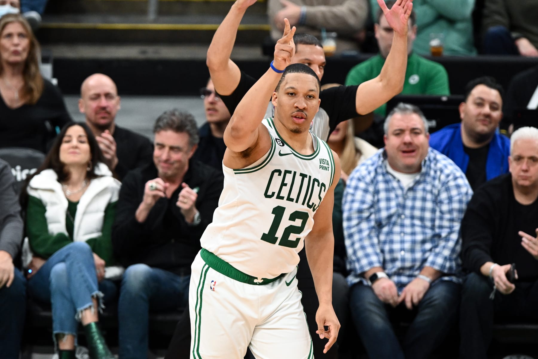 BOSTON, MASSACHUSETTS - FEBRUARY 08: Grant Williams #12 of the Boston Celtics reacts after making a three-point basket against the Philadelphia 76ers during the second quarter at the TD Garden on February 08, 2023 in Boston, Massachusetts. NOTE TO USER: User expressly acknowledges and agrees that, by downloading and or using this photograph, User is consenting to the terms and conditions of the Getty Images License Agreement.  (Photo by Brian Fluharty/Getty Images)