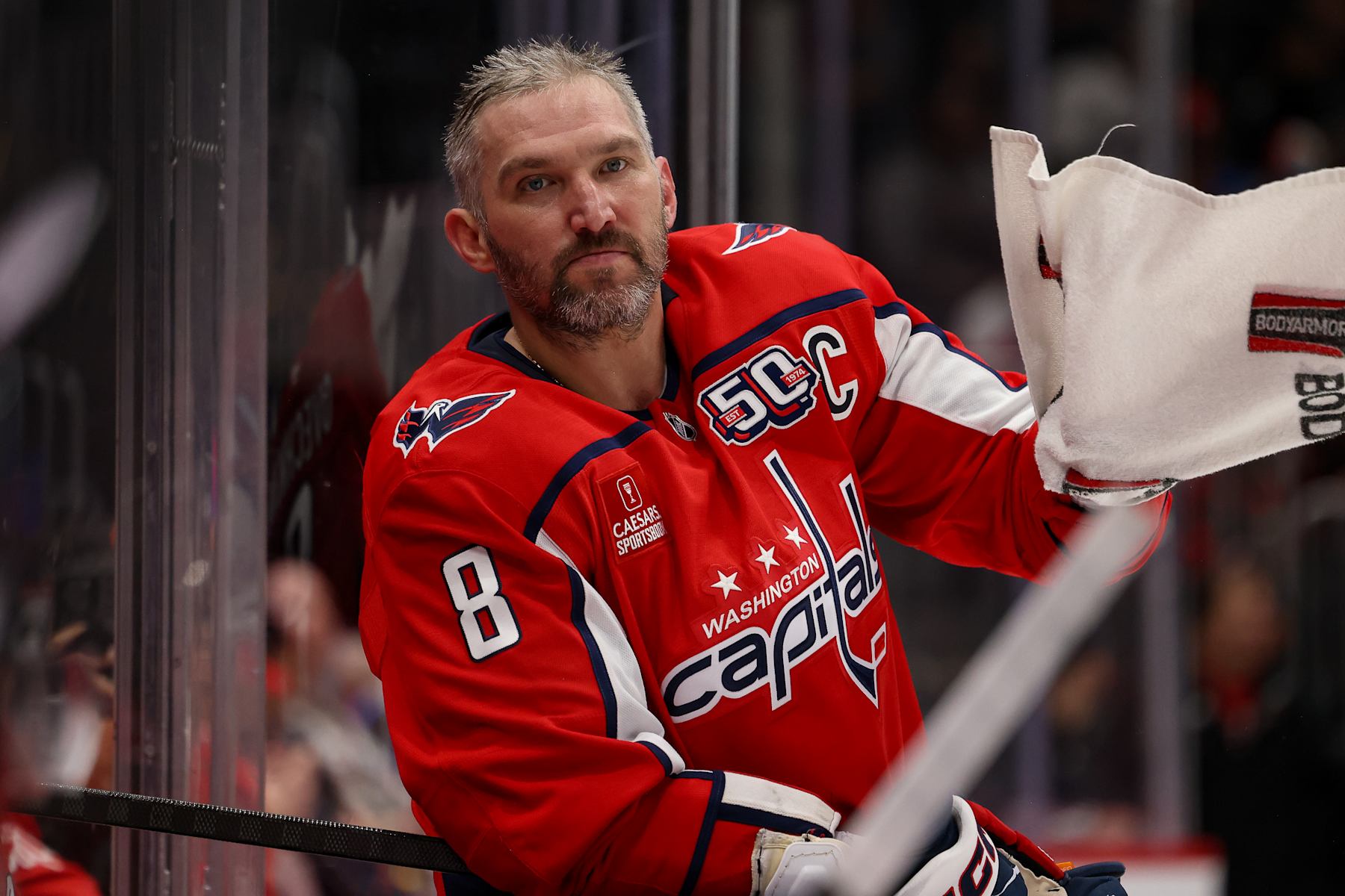 WASHINGTON, DC - SEPTEMBER 27: Alex Ovechkin #8 of the Washington Capitals rests during a TV Timeout during a preseason game against the Columbus Blue Jackets at Capital One Arena on September 27, 2024 in Washington, D.C. (Photo by John McCreary/NHLI via Getty Images)
