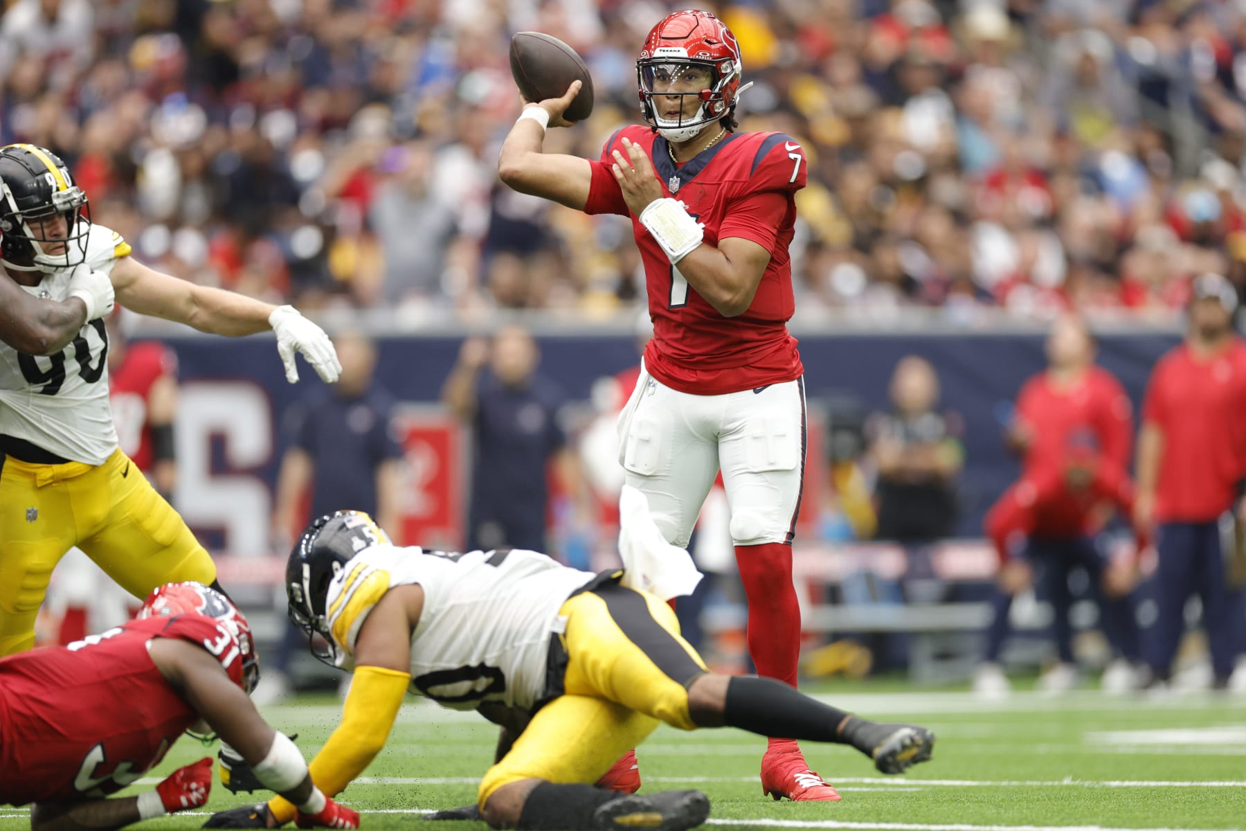 HOUSTON, TEXAS - OCTOBER 01: C.J. Stroud #7 of the Houston Texans attempts a pass during the second quarter against the Pittsburgh Steelers at NRG Stadium on October 01, 2023 in Houston, Texas. (Photo by Carmen Mandato/Getty Images)