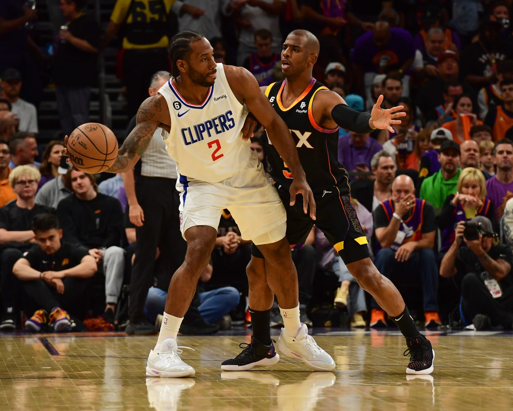 PHOENIX, AZ - APRIL 18:  Kawhi Leonard #2 of the LA Clippers handles the ball during the game  against Chris Paul #3 of the Phoenix Suns during round one game two of the 2023 NBA Playoffs on April 18, 2023 at Footprint Center in Phoenix, Arizona. NOTE TO USER: User expressly acknowledges and agrees that, by downloading and or using this photograph, user is consenting to the terms and conditions of the Getty Images License Agreement. Mandatory Copyright Notice: Copyright 2023 NBAE (Photo by Kate Frese/NBAE via Getty Images)