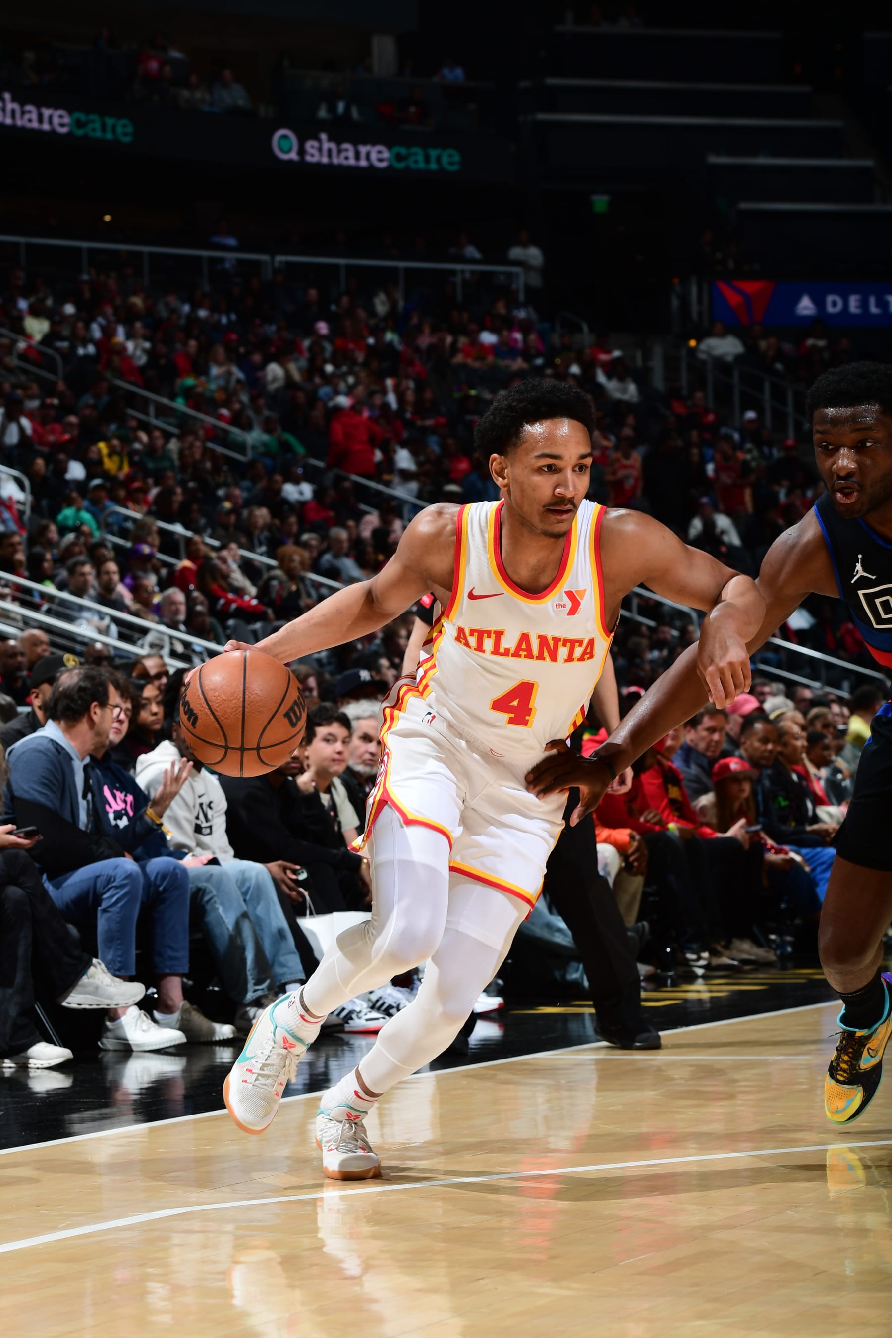 ATLANTA, GA - APRIL 3: Kobe Bufkin #4 of the Atlanta Hawks dribbles the ball during the game against the Detroit Pistons on April 3, 2024 at State Farm Arena in Atlanta, Georgia.  NOTE TO USER: User expressly acknowledges and agrees that, by downloading and/or using this Photograph, user is consenting to the terms and conditions of the Getty Images License Agreement. Mandatory Copyright Notice: Copyright 2024 NBAE (Photo by Scott Cunningham/NBAE via Getty Images)