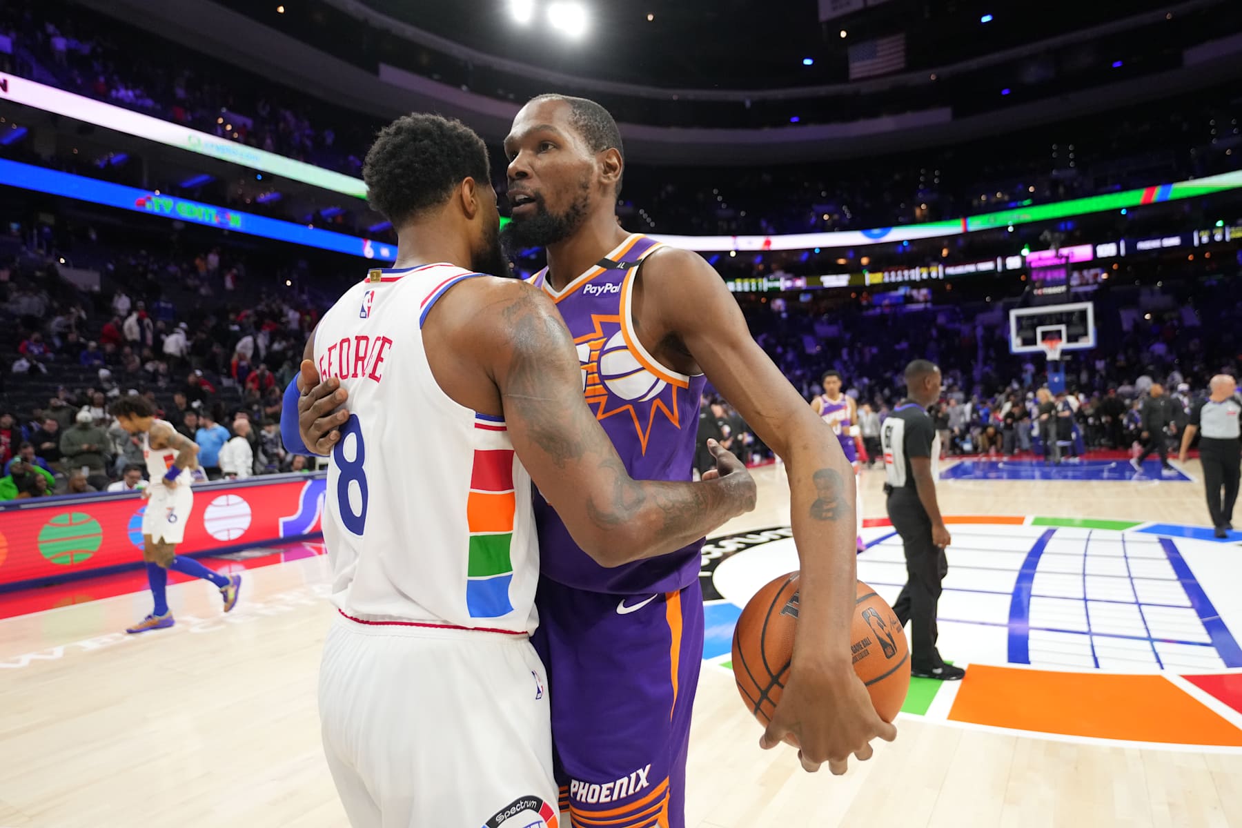 PHILADELPHIA, PA - JANUARY 6: Paul George #8 of the Philadelphia 76ers and Kevin Durant #35 of the Phoenix Suns high five after the game on January 6, 2025 at the Wells Fargo Center in Philadelphia, Pennsylvania NOTE TO USER: User expressly acknowledges and agrees that, by downloading and/or using this Photograph, user is consenting to the terms and conditions of the Getty Images License Agreement. Mandatory Copyright Notice: Copyright 2025 NBAE (Photo by Jesse D. Garrabrant/NBAE via Getty Images)