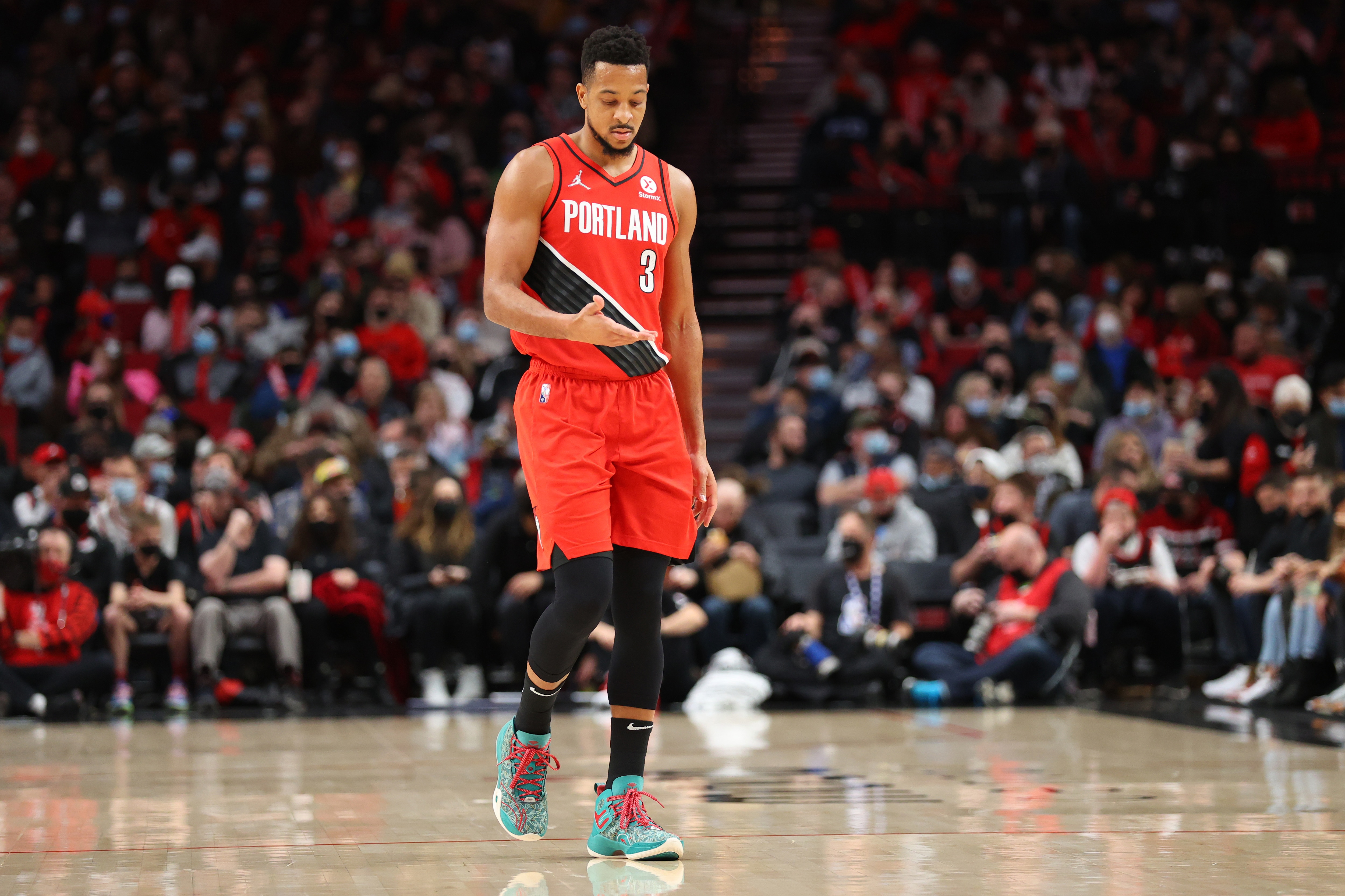 PORTLAND, OREGON - DECEMBER 02: CJ McCollum #3 of the Portland Trail Blazers reacts during the first quarter against the San Antonio Spurs at Moda Center on December 02, 2021 in Portland, Oregon. NOTE TO USER: User expressly acknowledges and agrees that, by downloading and or using this photograph, User is consenting to the terms and conditions of the Getty Images License Agreement.  (Photo by Abbie Parr/Getty Images)