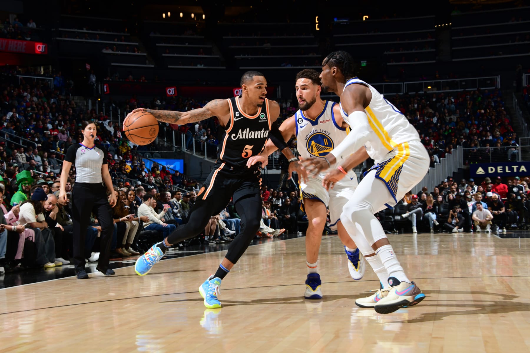 ATLANTA, GA - MARCH 17: Dejounte Murray #5 of the Atlanta Hawks dribbles the ball during the game against the Golden State Warriors on March 17, 2023 at State Farm Arena in Atlanta, Georgia.  NOTE TO USER: User expressly acknowledges and agrees that, by downloading and/or using this Photograph, user is consenting to the terms and conditions of the Getty Images License Agreement. Mandatory Copyright Notice: Copyright 2023 NBAE (Photo by Scott Cunningham/NBAE via Getty Images)