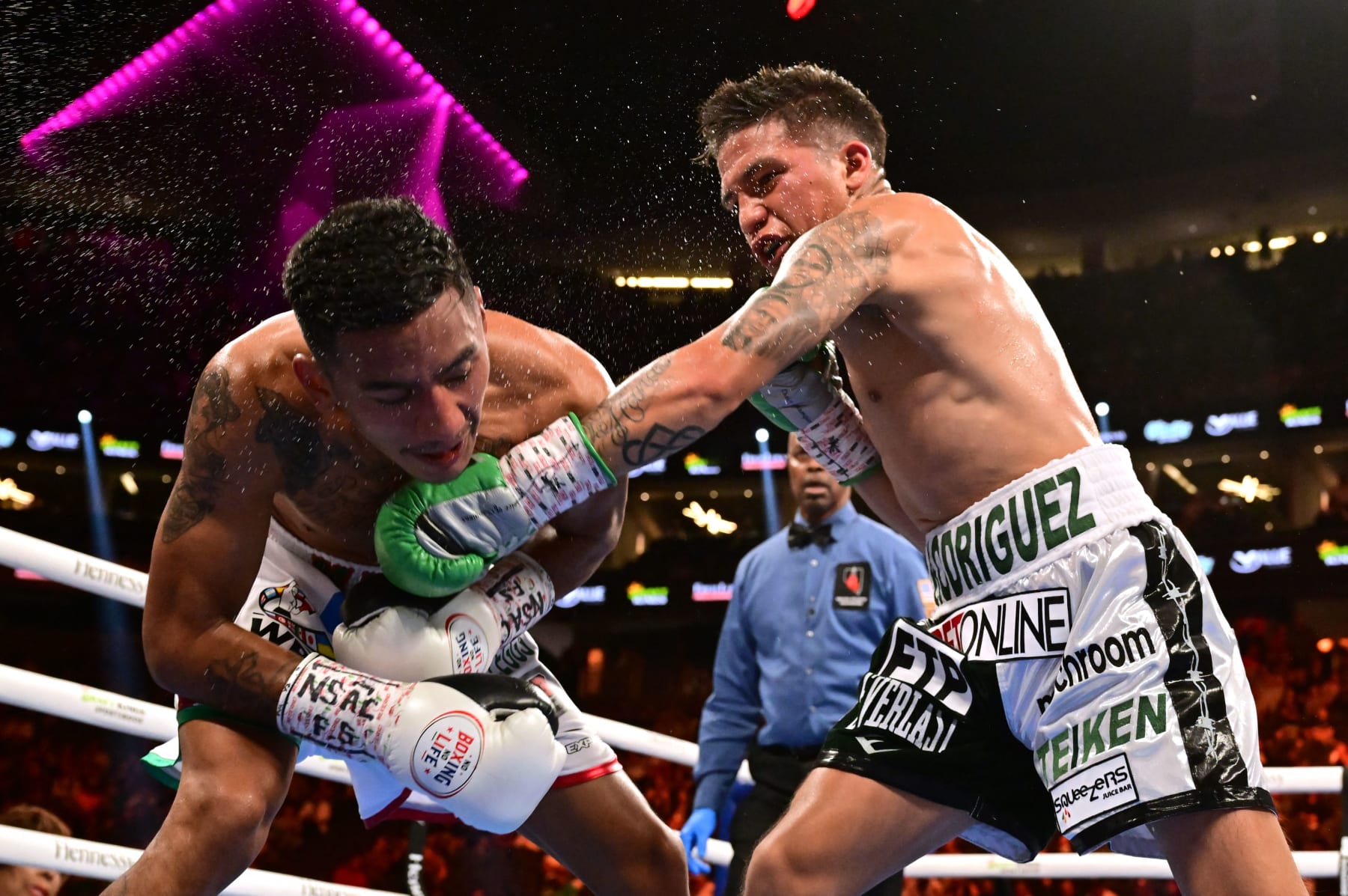 TOPSHOT - US boxer Jesse Rodriguez (R) lands a punch on Mexican boxer Israel Gonzalez during their World Boxing Council (WBC) super flyweight title bout at the T-Mobile Arena in Las Vegas, Nevada, September 17, 2022. (Photo by Frederic J. BROWN / AFP) (Photo by FREDERIC J. BROWN/AFP via Getty Images)