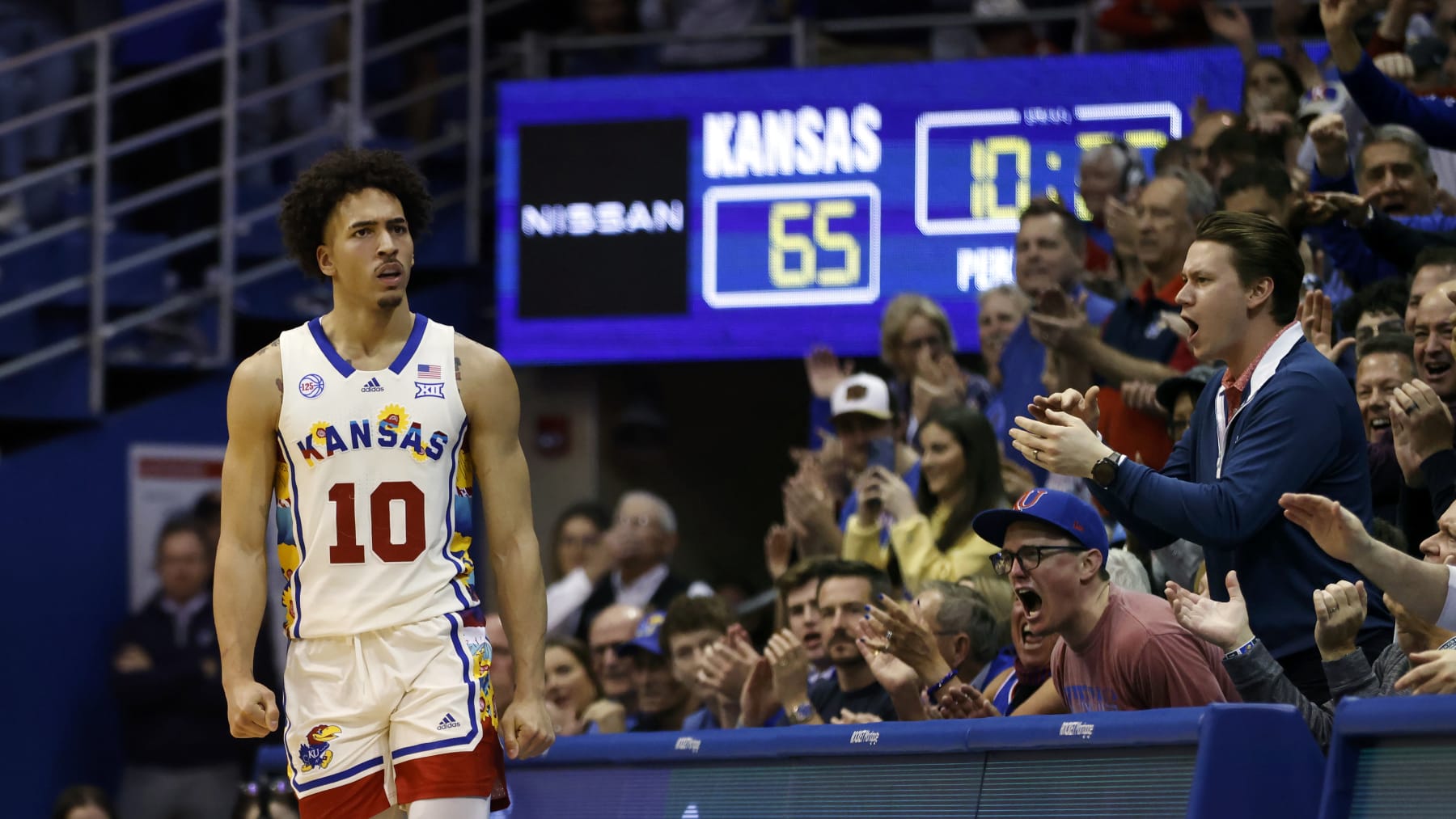 Kansas forward Jalen Wilson (10) and fans react after scoring against Baylor during the second half of an NCAA college basketball game, Saturday, Feb. 18, 2023, in Lawrence, Kan. (AP Photo/Colin E. Braley)