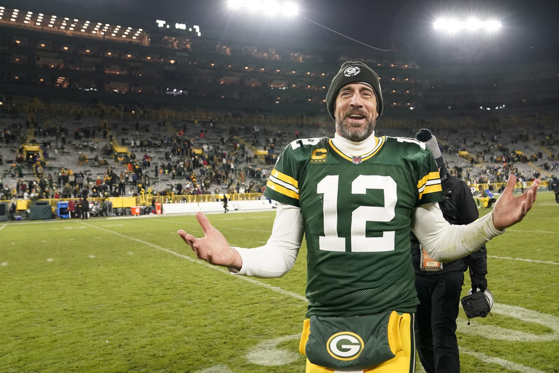 GREEN BAY, WISCONSIN - DECEMBER 19: Aaron Rodgers #12 of the Green Bay Packers walks off the field after defeating the Los Angeles Rams 24-12 at Lambeau Field on December 19, 2022 in Green Bay, Wisconsin. (Photo by Patrick McDermott/Getty Images)