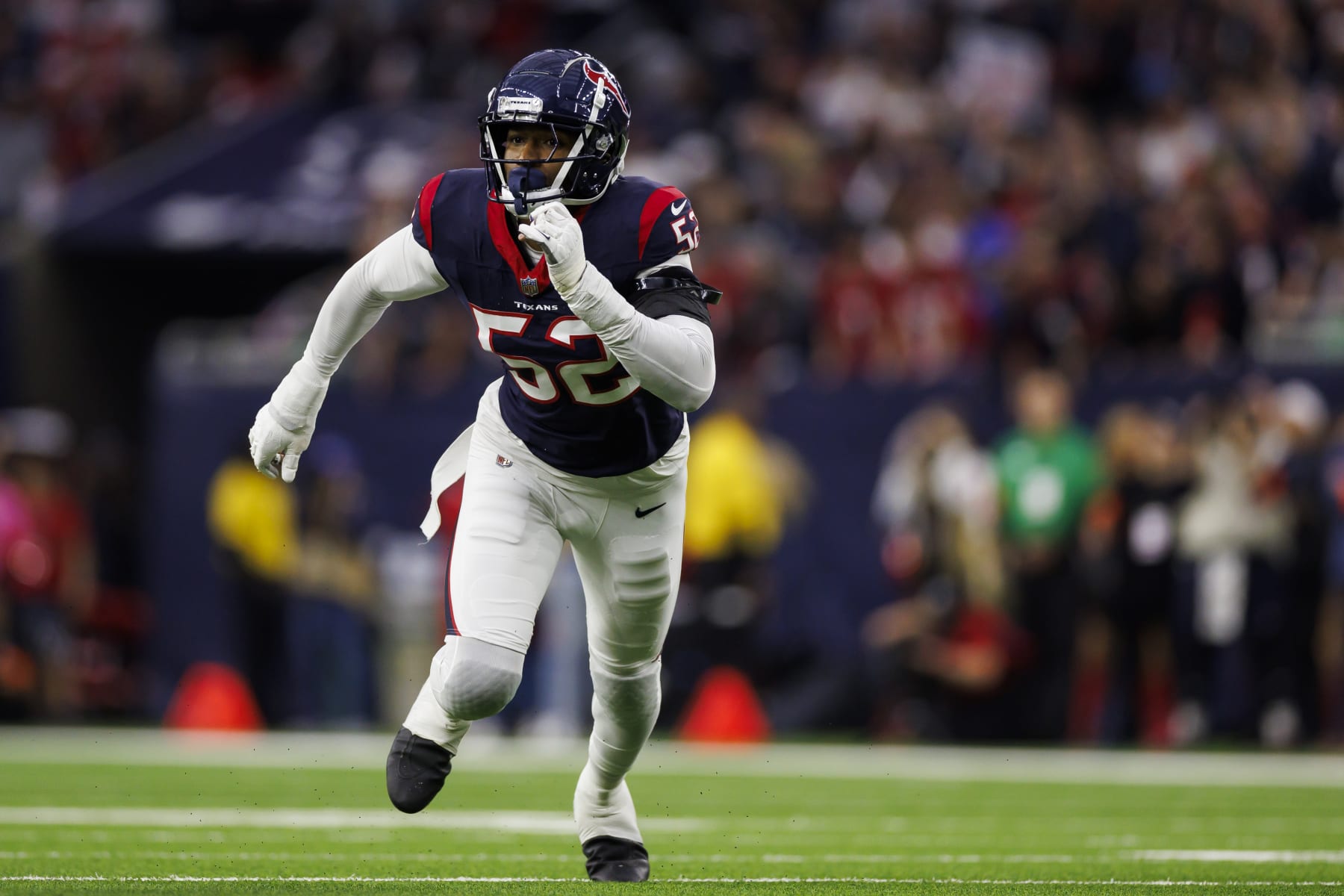HOUSTON, TEXAS - JANUARY 13: Jonathan Greenard #52 of the Houston Texans runs around the edge during an AFC wild-card playoff football game against the Cleveland Browns at NRG Stadium on January 13, 2024 in Houston, Texas. (Photo by Ryan Kang/Getty Images)