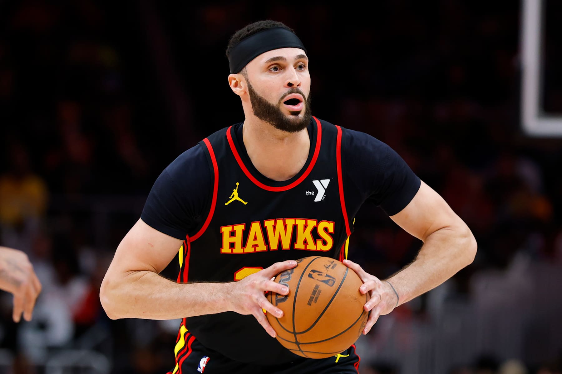 ATLANTA, GEORGIA - DECEMBER 28: Larry Nance Jr. #22 of the Atlanta Hawks passes during the third quarter against the Miami Heat at State Farm Arena on December 28, 2024 in Atlanta, Georgia. NOTE TO USER: User expressly acknowledges and agrees that, by downloading and or using this photograph, User is consenting to the terms and conditions of the Getty Images License Agreement. (Photo by Todd Kirkland/Getty Images)