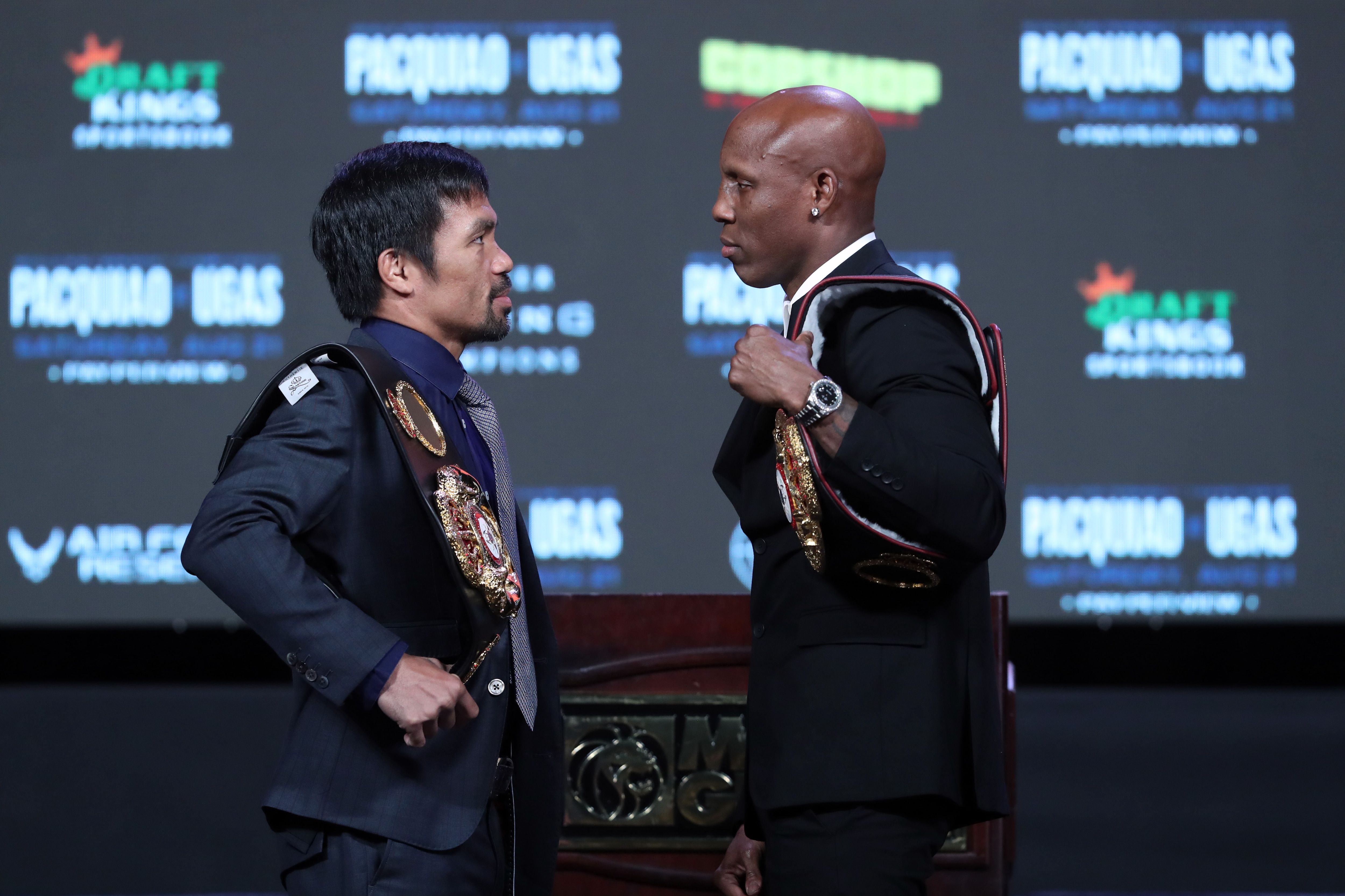 LAS VEGAS, NEVADA - AUGUST 18: Manny Pacquiao (L) and WBA welterweight champion Yordenis Ugas face off during a news conference at MGM Grand Garden Arena on August 18, 2021 in Las Vegas, Nevada. Pacquiao will challenge Ugas for his title at T-Mobile Arena on August 21 in Las Vegas. (Photo by Steve Marcus/Getty Images)