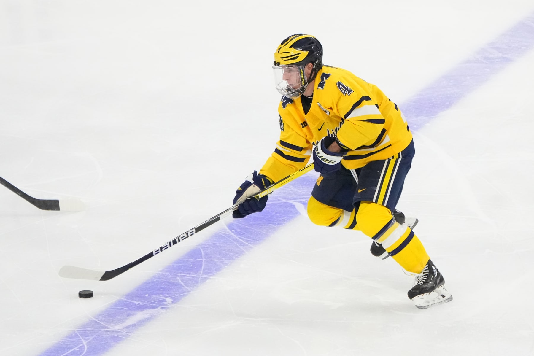 ALLENTOWN, PA - MARCH 26: Michigan Wolverines Forward Gavin Brindley (4) skates with the puck during the second period of the 2023 NCAA Division I Mens Ice Hockey Regional Final between the Penn State Nittany Lions and the Michigan Wolverines on March 26, 2023, at the PPL Center in Allentown, PA. (Photo by Gregory Fisher/Icon Sportswire via Getty Images)
