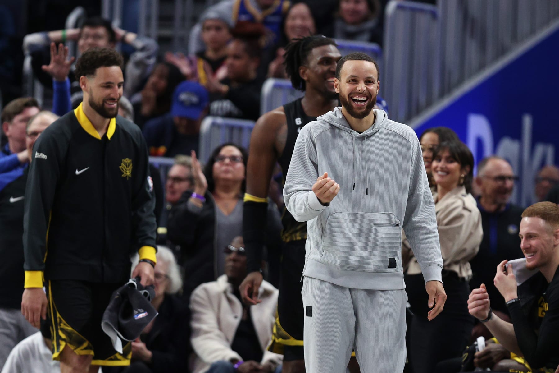 SAN FRANCISCO, CALIFORNIA - MARCH 02:  Injured Stephen Curry #30 of the Golden State Warriors cheers on his team on the bench during their game against the LA Clippers at Chase Center on March 02, 2023 in San Francisco, California. NOTE TO USER: User expressly acknowledges and agrees that, by downloading and or using this photograph, User is consenting to the terms and conditions of the Getty Images License Agreement.   (Photo by Ezra Shaw/Getty Images)