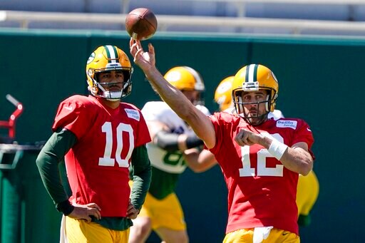 Green Bay Packers' Jordan Love watches Aaron Rodgers throw during NFL football practice Friday, Sept. 4, 2020, in Green Bay, Wis. (AP Photo/Morry Gash)