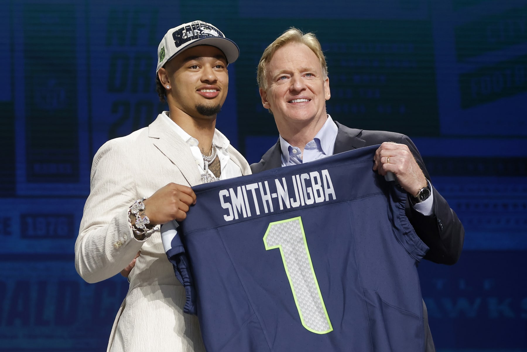 KANSAS CITY, MISSOURI - APRIL 27: (L-R) Jaxon Smith-Njigba poses with NFL Commissioner Roger Goodell after being selected 20th overall by the Seattle Seahawks during the first round of the 2023 NFL Draft at Union Station on April 27, 2023 in Kansas City, Missouri. (Photo by David Eulitt/Getty Images)
