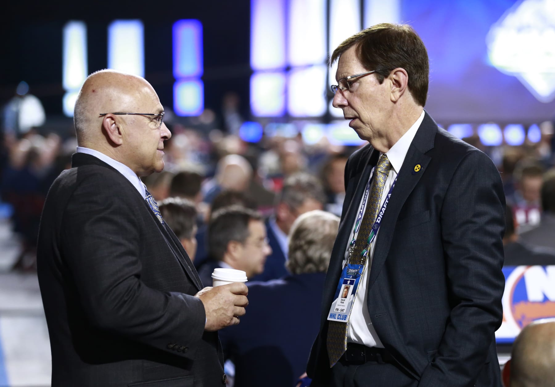 VANCOUVER, BRITISH COLUMBIA - JUNE 22: Head coach Barry Trotz (L) of the New York Islanders and general manager David Poile of the Nashville Predators talk on the draft floor during Rounds 2-7 of the 2019 NHL Draft at Rogers Arena on June 22, 2019 in Vancouver, Canada. (Photo by Jeff Vinnick/NHLI via Getty Images)