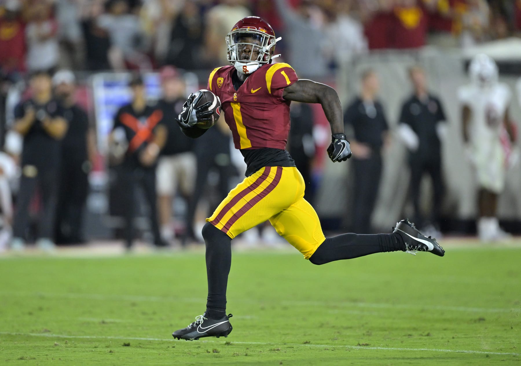 LOS ANGELES, CALIFORNIA - SEPTEMBER 9: Wide receiver Zachariah Branch #1 of the USC Trojans runs a kick off down the field for a touchdown in the first half against the Stanford Cardinal at United Airlines Field at the Los Angeles Memorial Coliseum on September 9, 2023 in Los Angeles, California. (Photo by Jayne Kamin-Oncea/Getty Images)