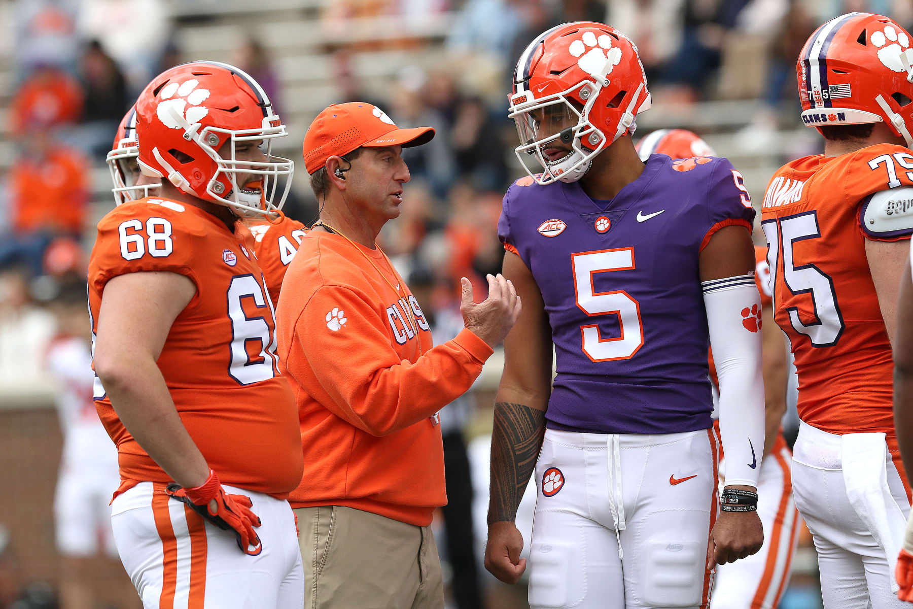 CLEMSON, SC - APRIL 09: Dabo Swinney head coach of Clemson talks with D.J. Uiagalelei (5) quarterback of Clemson during the annual Orange and White Spring football game on April 9, 2022 at Clemson Memorial Stadium in Clemson, S.C. (Photo by John Byrum/Icon Sportswire via Getty Images)