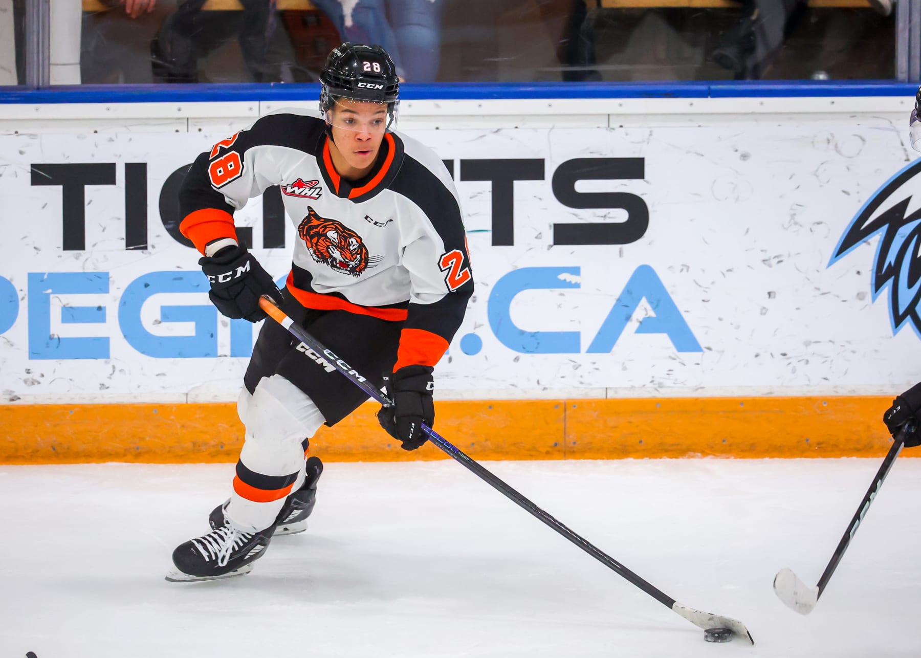 WINNIPEG, CANADA - APRIL 01: Cayden Lindstrom #28 of the Medicine Hat Tigers plays the puck during second period action against the Winnipeg ICE in Game Two of the First Round of the 2023 WHL Playoffs at Wayne Fleming Arena on April 01, 2023 in Winnipeg, Manitoba, Canada. (Photo by Jonathan Kozub/Getty Images)