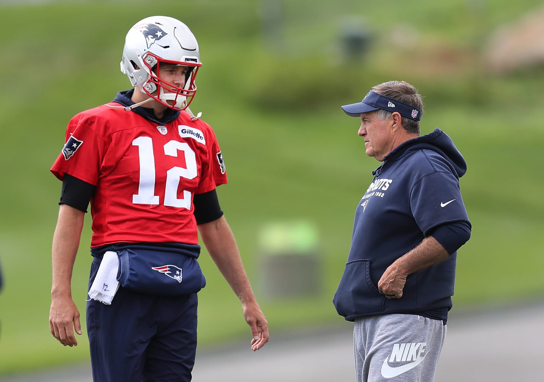 FOXBOROUGH, MA - SEPTEMBER 18: New England Patriots quarterback Tom Brady (12) and head coach Bill Belichick chat during New England Patriots practice at Gillette Stadium in Foxborough, MA on Sep. 18, 2019. (Photo by John Tlumacki/The Boston Globe via Getty Images)