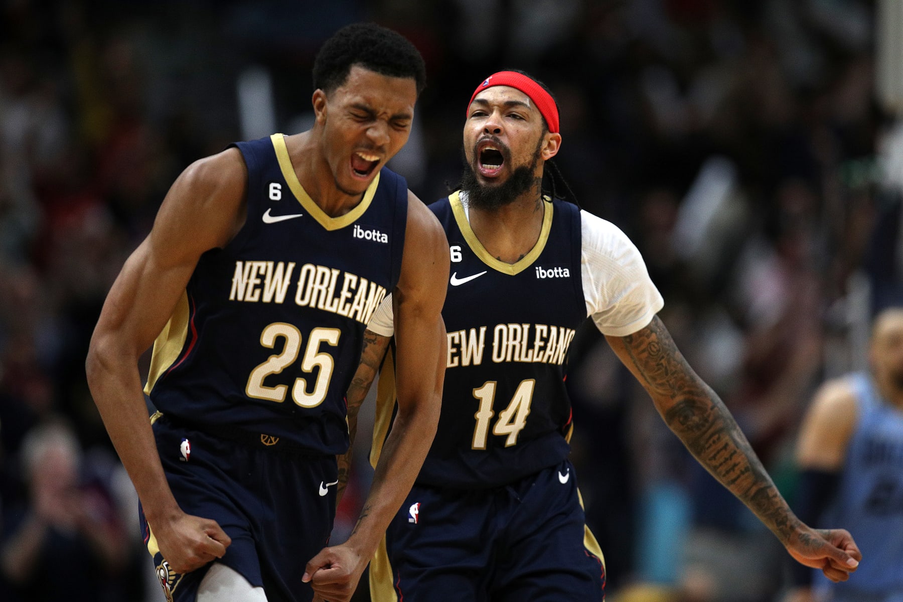 NEW ORLEANS, LOUISIANA - APRIL 05: Brandon Ingram #14 of the New Orleans Pelicans reacts with Trey Murphy III #25 of the New Orleans Pelicans after scoring a three point basket during the fourth quarter of an NBA game against the Memphis Grizzlies at Smoothie King Center on April 05, 2023 in New Orleans, Louisiana. NOTE TO USER: User expressly acknowledges and agrees that, by downloading and or using this photograph, User is consenting to the terms and conditions of the Getty Images License Agreement. (Photo by Sean Gardner/Getty Images)
