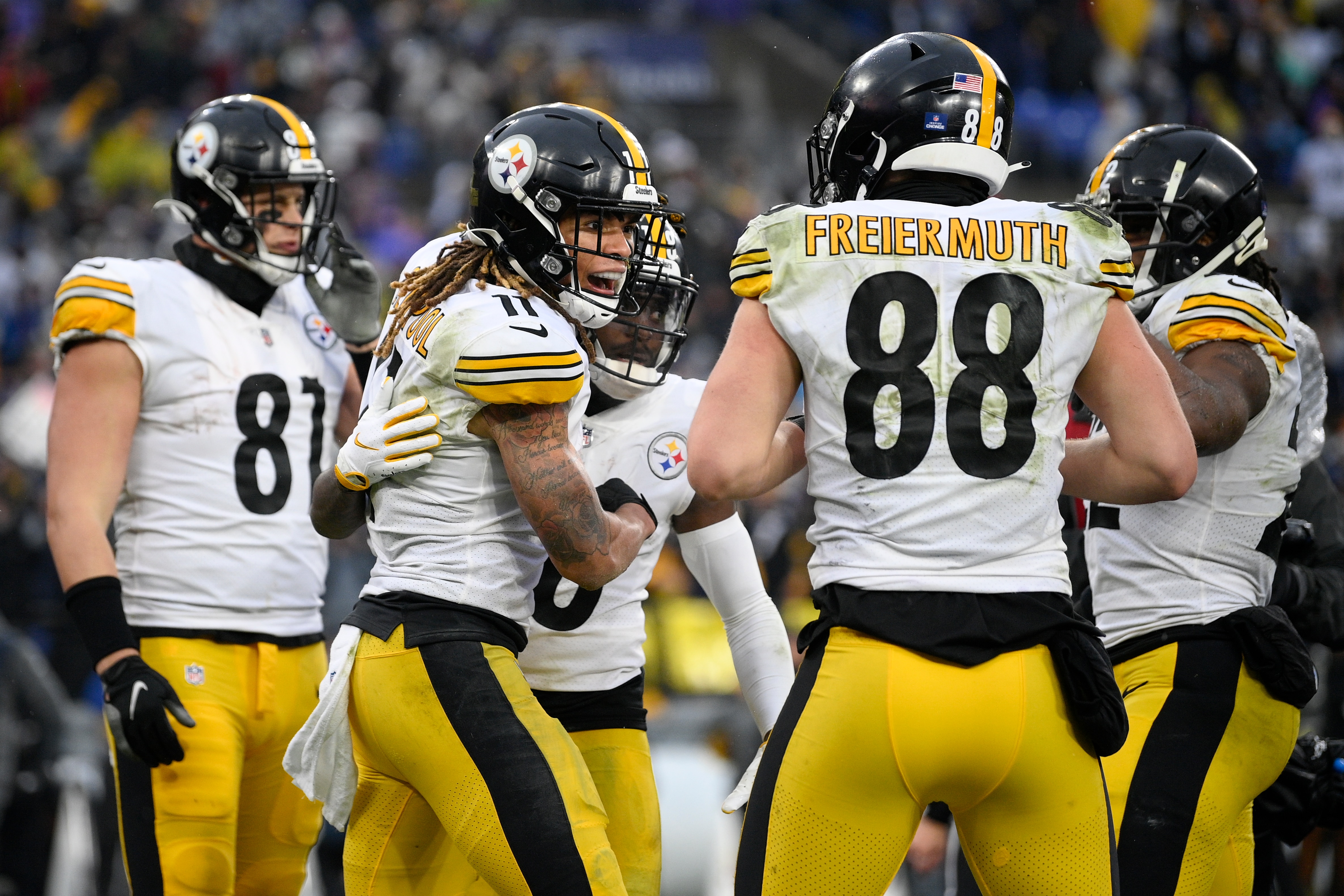 Pittsburgh Steelers wide receiver Chase Claypool, center left, reacts with teammates after scoring a touchdown on a pass from quarterback Ben Roethlisberger during the second half of an NFL football game against the Baltimore Ravens, Sunday, Jan. 9, 2022, in Baltimore. (AP Photo/Nick Wass)