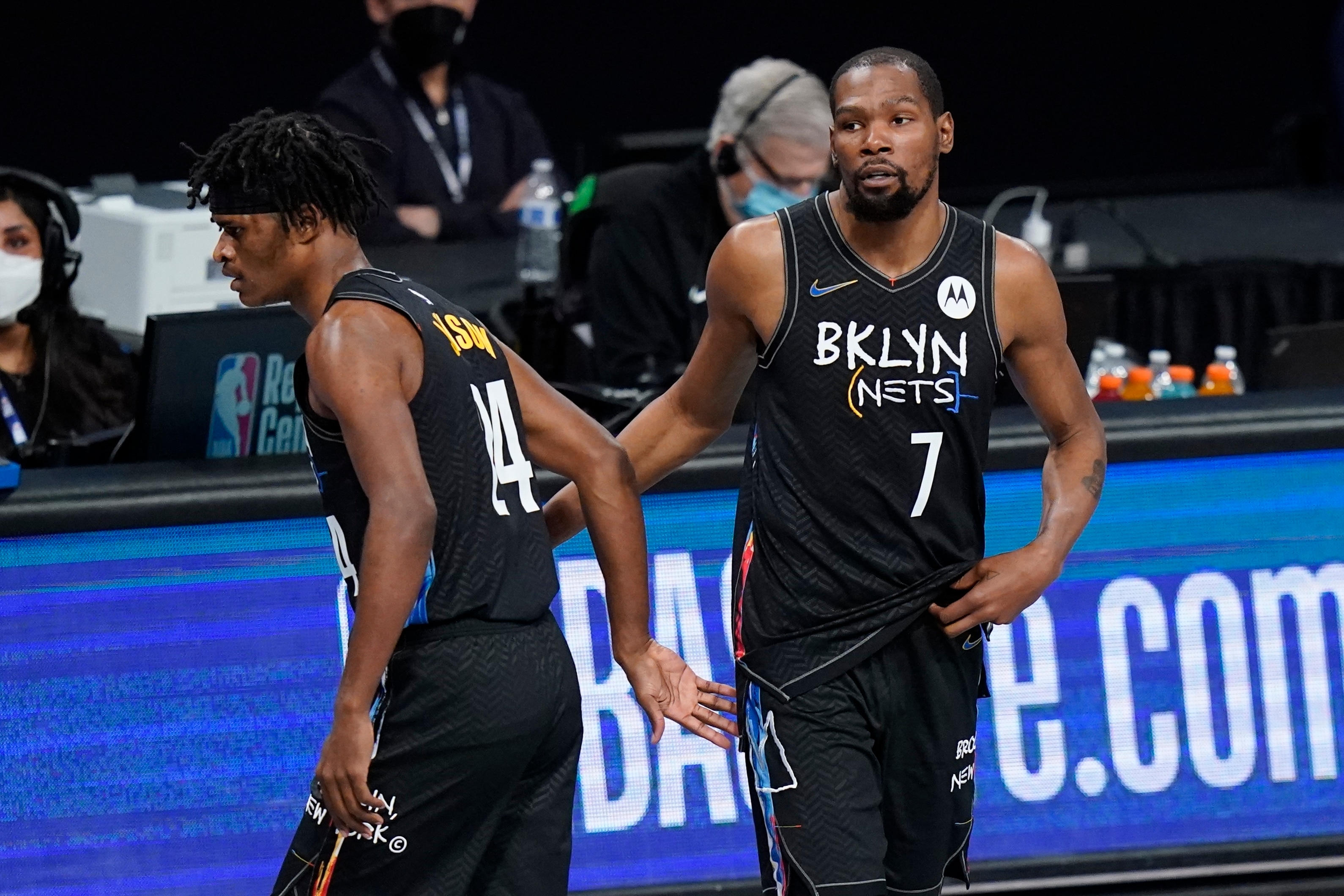 Brooklyn Nets' Kevin Durant (7) checks in for Alize Johnson (24) during the first half of an NBA basketball game Wednesday, April 7, 2021, in New York. (AP Photo/Frank Franklin II)