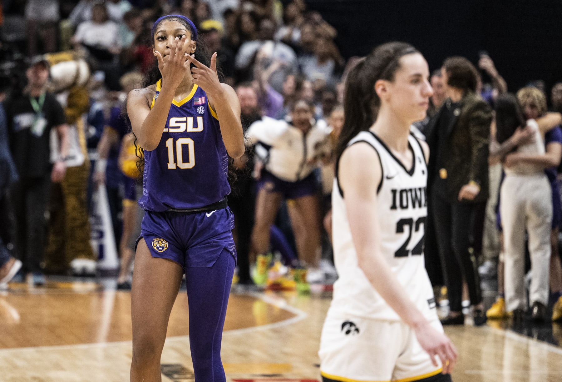 DALLAS, TEXAS - APRIL 02: Angel Reese #10 of the LSU Lady Tigers reacts in front of Caitlin Clark #22 of the Iowa Hawkeyes towards the end of the 2023 NCAA Women's Basketball Tournament championship game at American Airlines Center on April 02, 2023 in Dallas, Texas. (Photo by Ben Solomon/NCAA Photos via Getty Images)