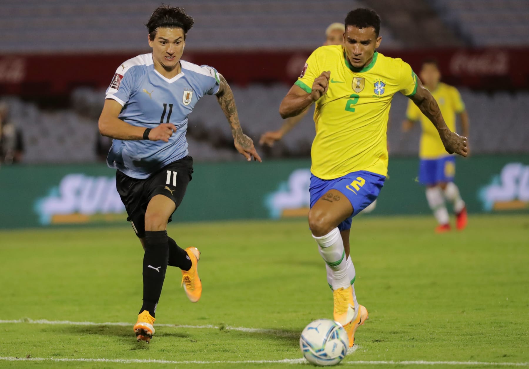 Brazil's Danilo (R) is challenged by Uruguay's Darwin Nunez during their closed-door 2022 FIFA World Cup South American qualifier football match at the Centenario Stadium in Montevideo on November 17, 2020. (Photo by Raul MARTINEZ / POOL / AFP) (Photo by RAUL MARTINEZ/POOL/AFP via Getty Images)