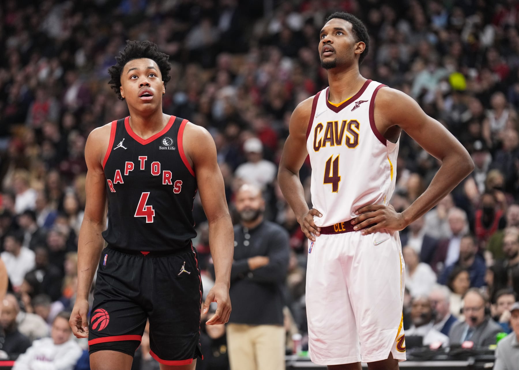 TORONTO, ON - MARCH 24: Scottie Barnes #4 of the Toronto Raptors and Evan Mobley #4 of the Cleveland Cavaliers look on in a break during the first half of their basketball game at the Scotiabank Arena on March 24, 2022 in Toronto, Ontario, Canada. NOTE TO USER: User expressly acknowledges and agrees that, by downloading and/or using this Photograph, user is consenting to the terms and conditions of the Getty Images License Agreement. (Photo by Mark Blinch/Getty Images)