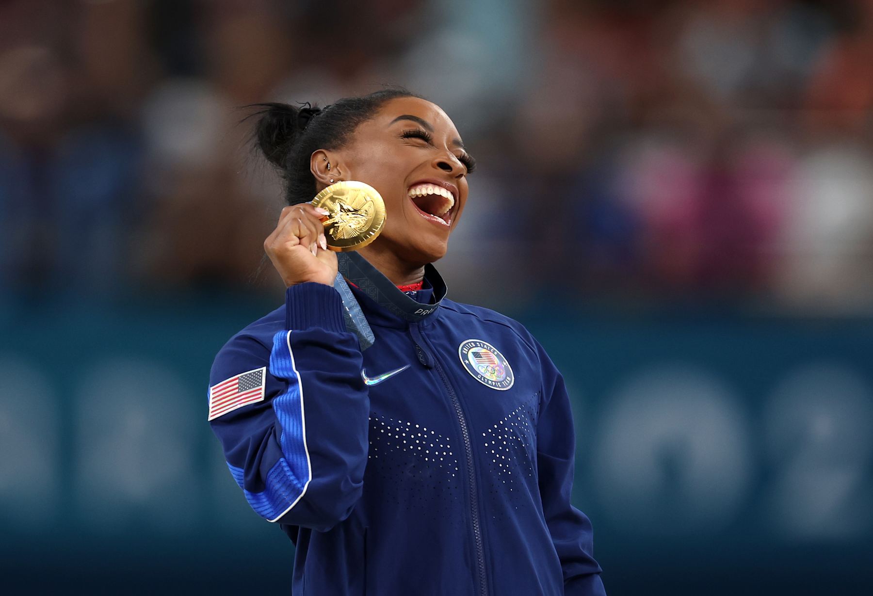 PARIS, FRANCE - AUGUST 03: Gold medalist Simone Biles of Team United States celebrates on the podium during the medal ceremony for the Artistic Gymnastics Women's Vault Final on day eight of the Olympic Games Paris 2024 at Bercy Arena on August 03, 2024 in Paris, France. (Photo by Julian Finney/Getty Images)
