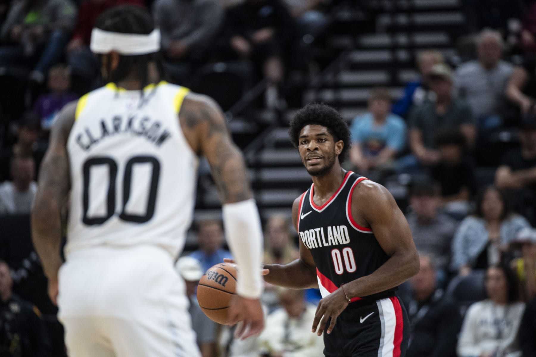 Portland Trail Blazers guard Scoot Henderson (00) brings the ball up the court against the Portland Trail Blazers during the first half of an NBA preseason basketball game Saturday, Oct. 14, 2023, in Salt Lake City. (AP Photo/Isaac Hale)