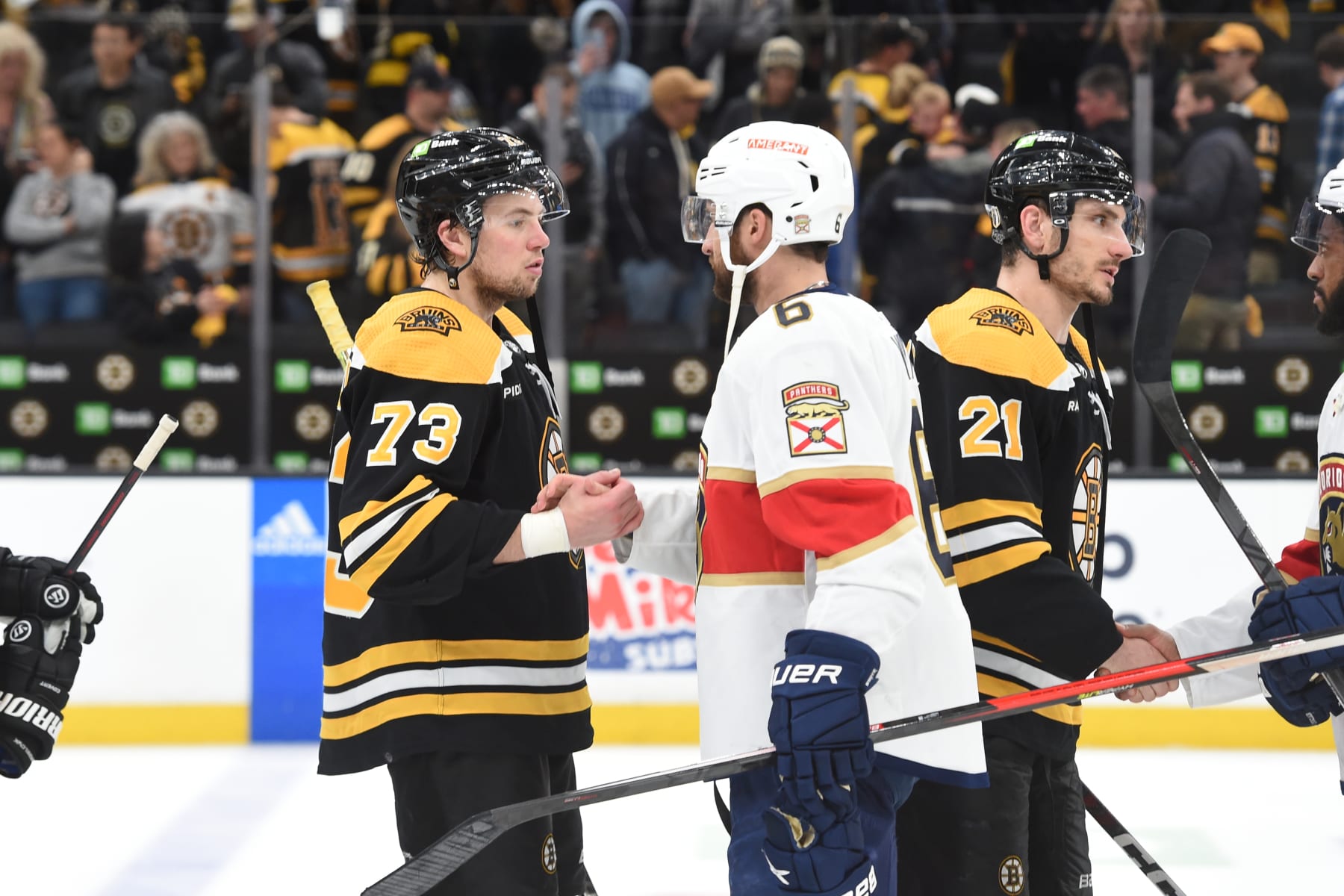 BOSTON, MASSACHUSETTS - APRIL 30: Charlie McAvoy #73 of the Boston Bruins shakes hands with Colin White #6 of the Florida Panthers after Game Seven of the First Round of the 2023 Stanley Cup Playoffs at TD Garden on April 30, 2023, in Boston, Massachusetts. (Photo by Steve Babineau/NHLI via Getty Images)