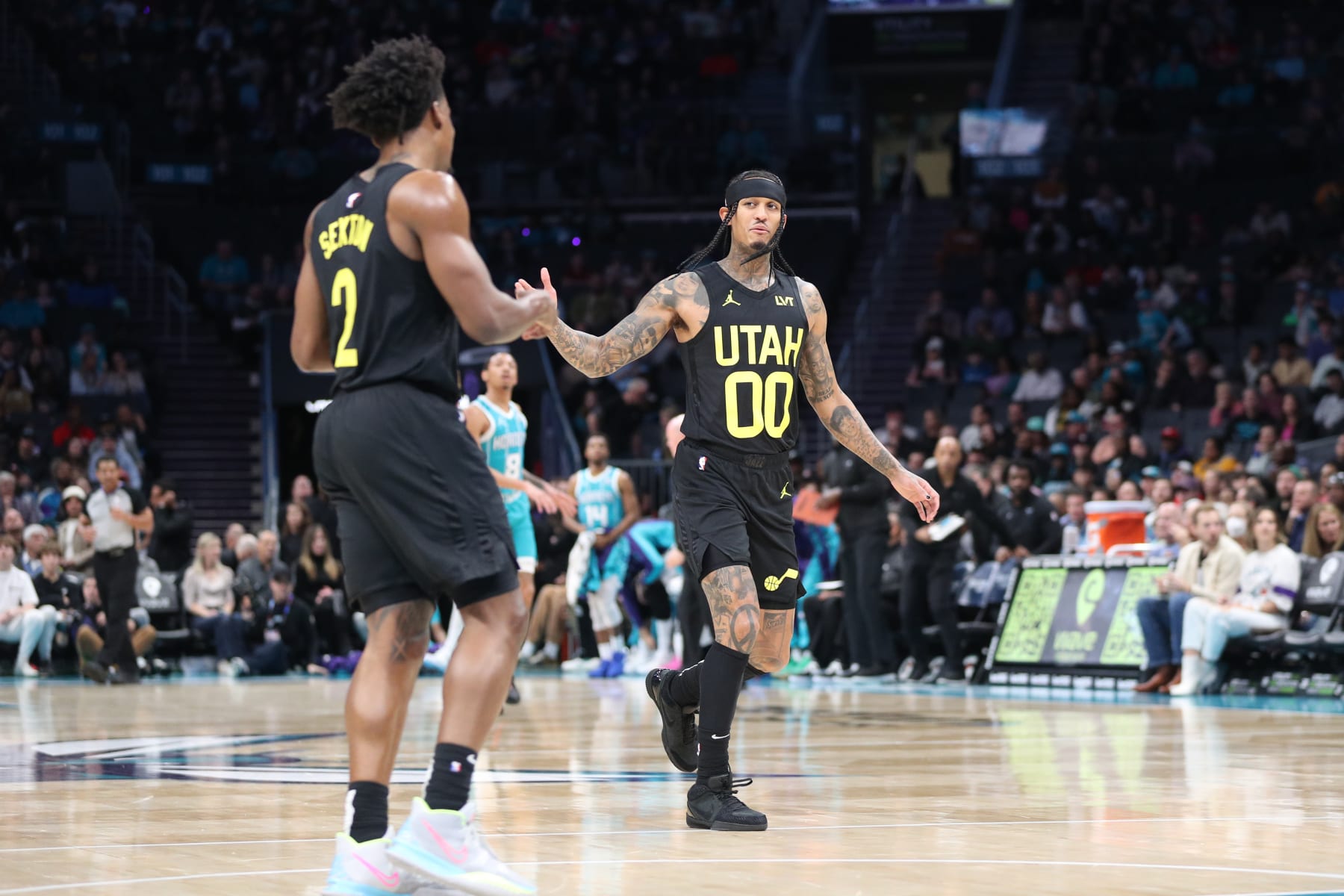 CHARLOTTE, NC - JANUARY 27: Colin Sexton #2 and Jordan Clarkson #00 of the Utah Jazz high five during the game against the Charlotte Hornets on January 27, 2024 at Spectrum Center in Charlotte, North Carolina. NOTE TO USER: User expressly acknowledges and agrees that, by downloading and or using this photograph, User is consenting to the terms and conditions of the Getty Images License Agreement.  Mandatory Copyright Notice:  Copyright 2024 NBAE (Photo by Brock Williams-Smith/NBAE via Getty Images)